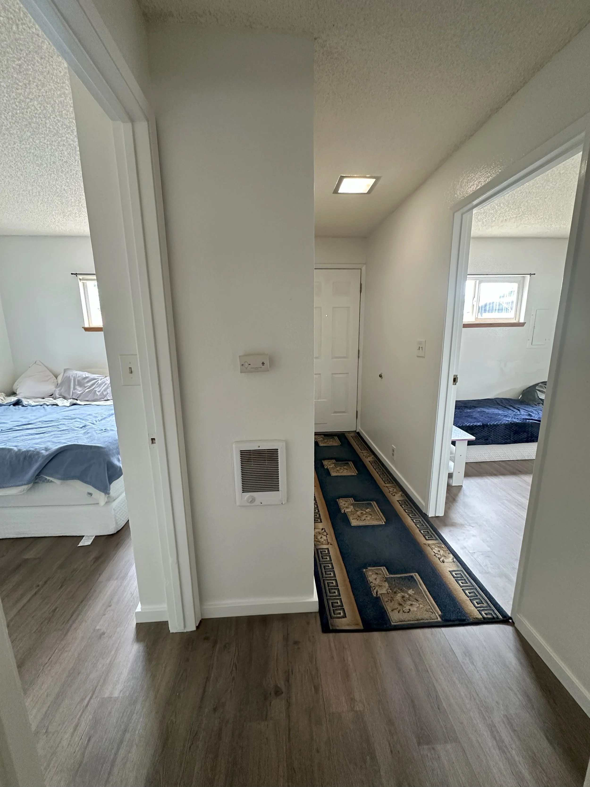 Back hall facing rooms and exit