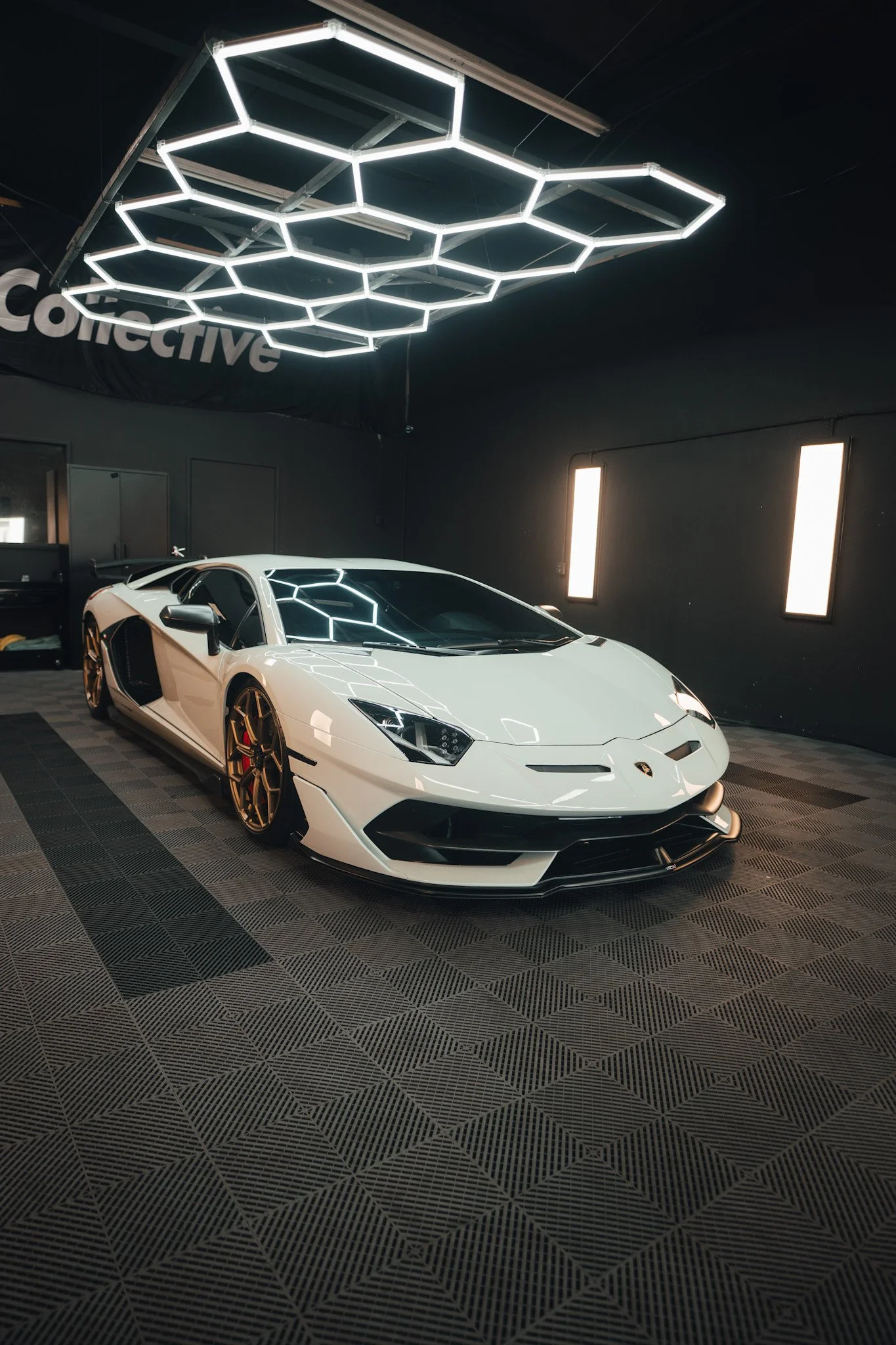 Detailing team applying PPF to Lamborghini