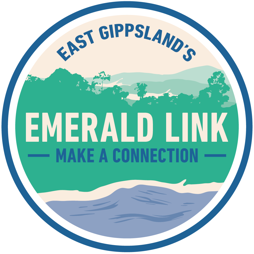 Logo for Emerald Link, East Gippland's community organization with a scenic background of trees, hills, and a lake, and the slogan 'Make a Connection'.