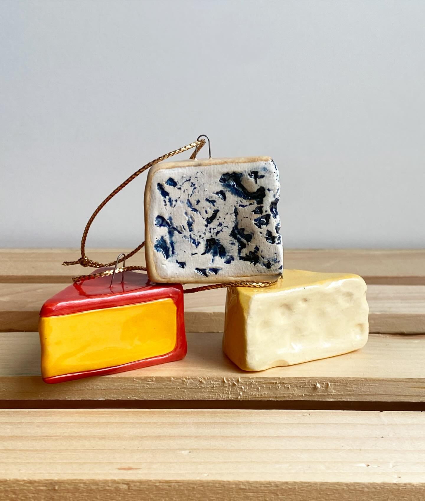 I accidentally made some cheese wedges in the wrong shape last year and decided they&rsquo;d be better as Swiss and gouda. Selling a VERY limited supply of these cheese ornaments on Saturday 11/29 at 10 am, as well as blue cheese, olives, ravioli, an