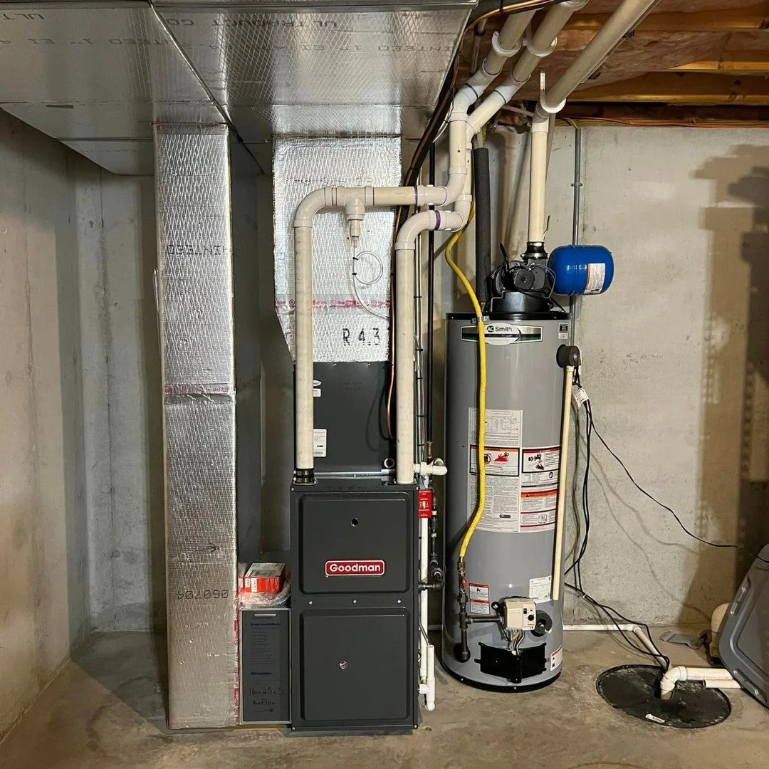tank water heater installed next to goodman furnace