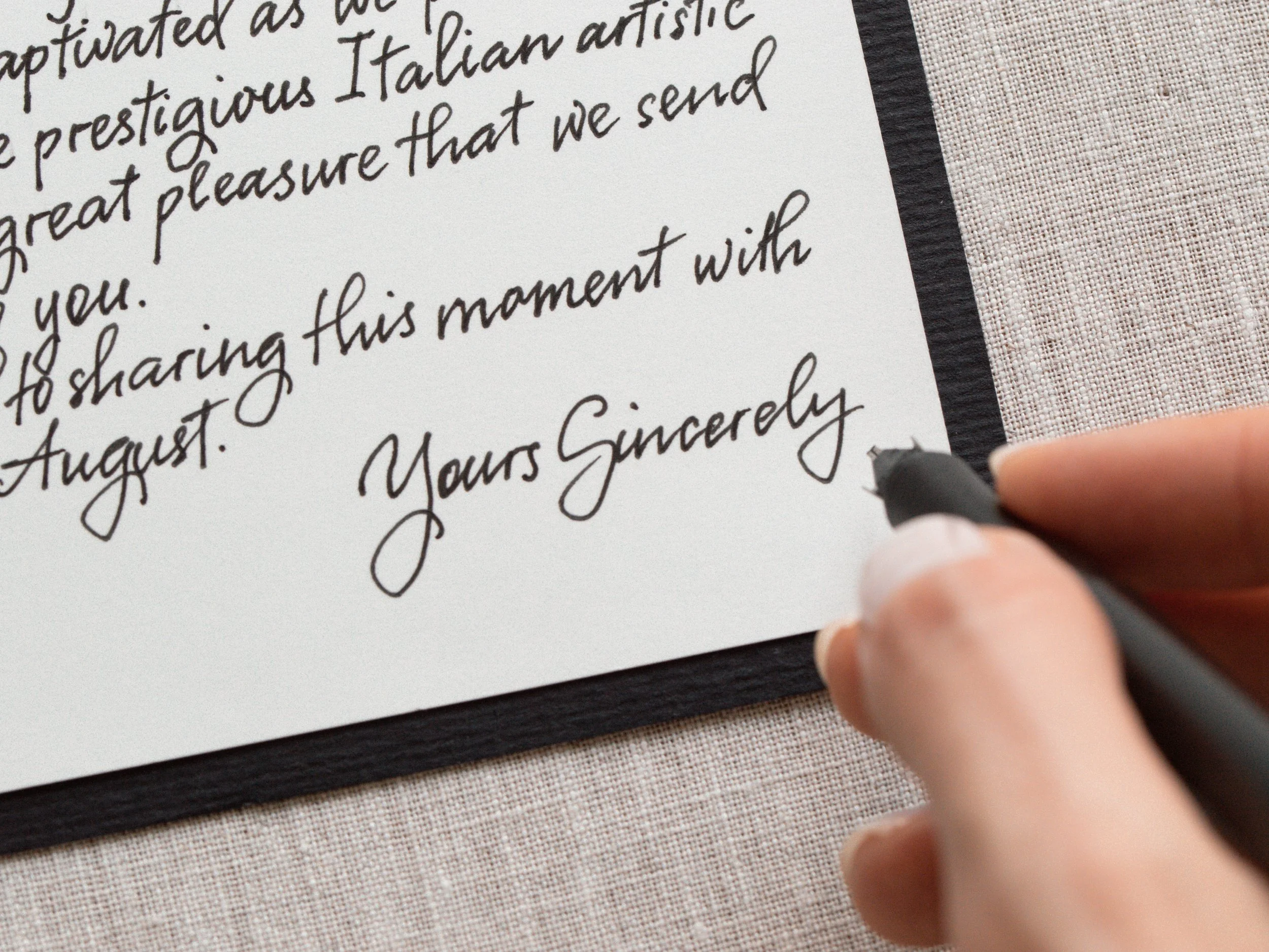 Handwritten calligraphy event invitations and addressed envelopes