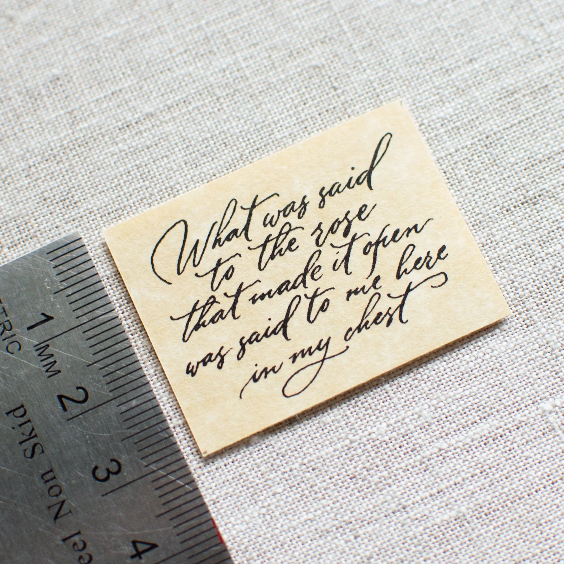 Custom calligraphy scroll tucked inside Ophelia Eve jewelry