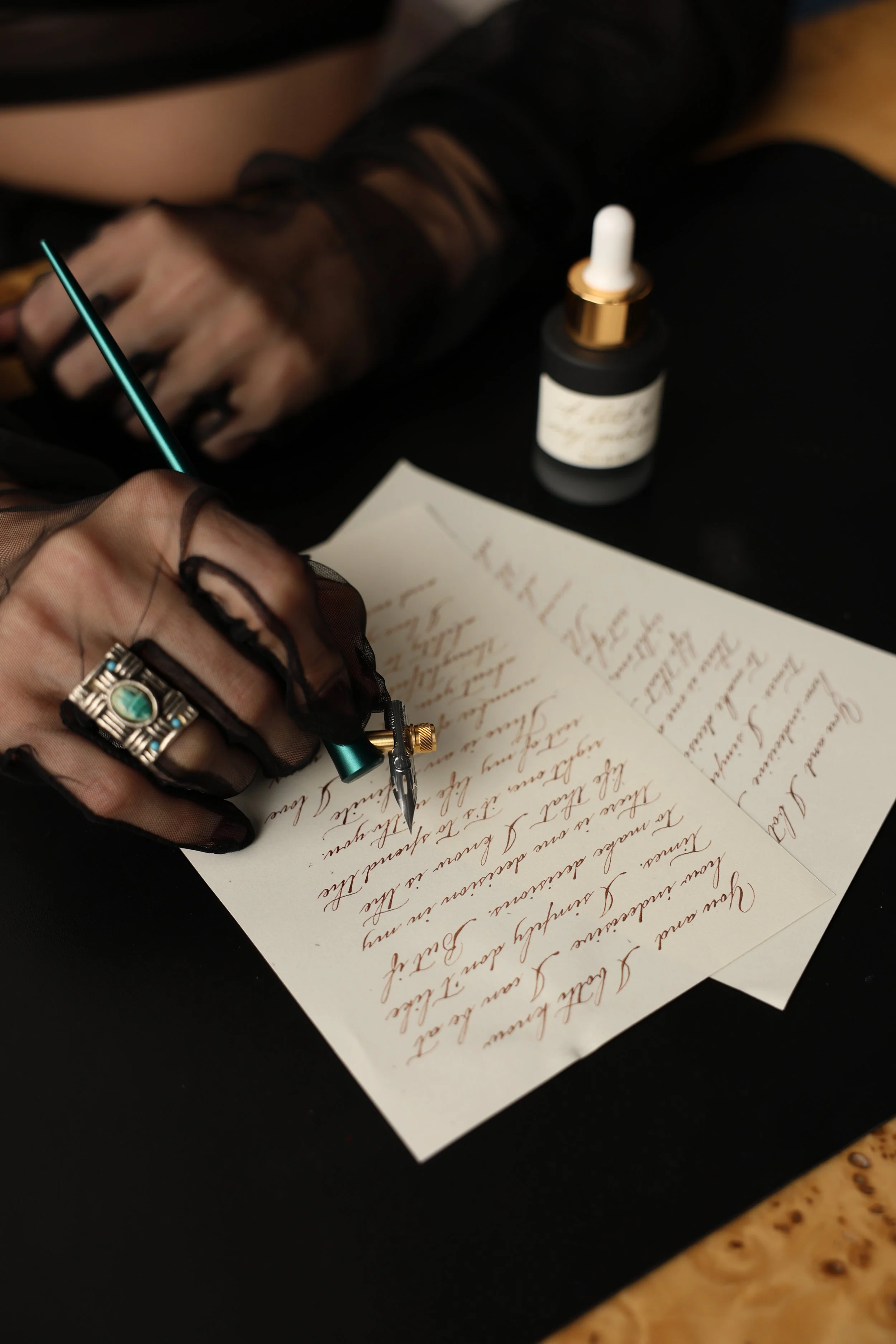Hand calligraphy for live product personalization at a luxury brand event