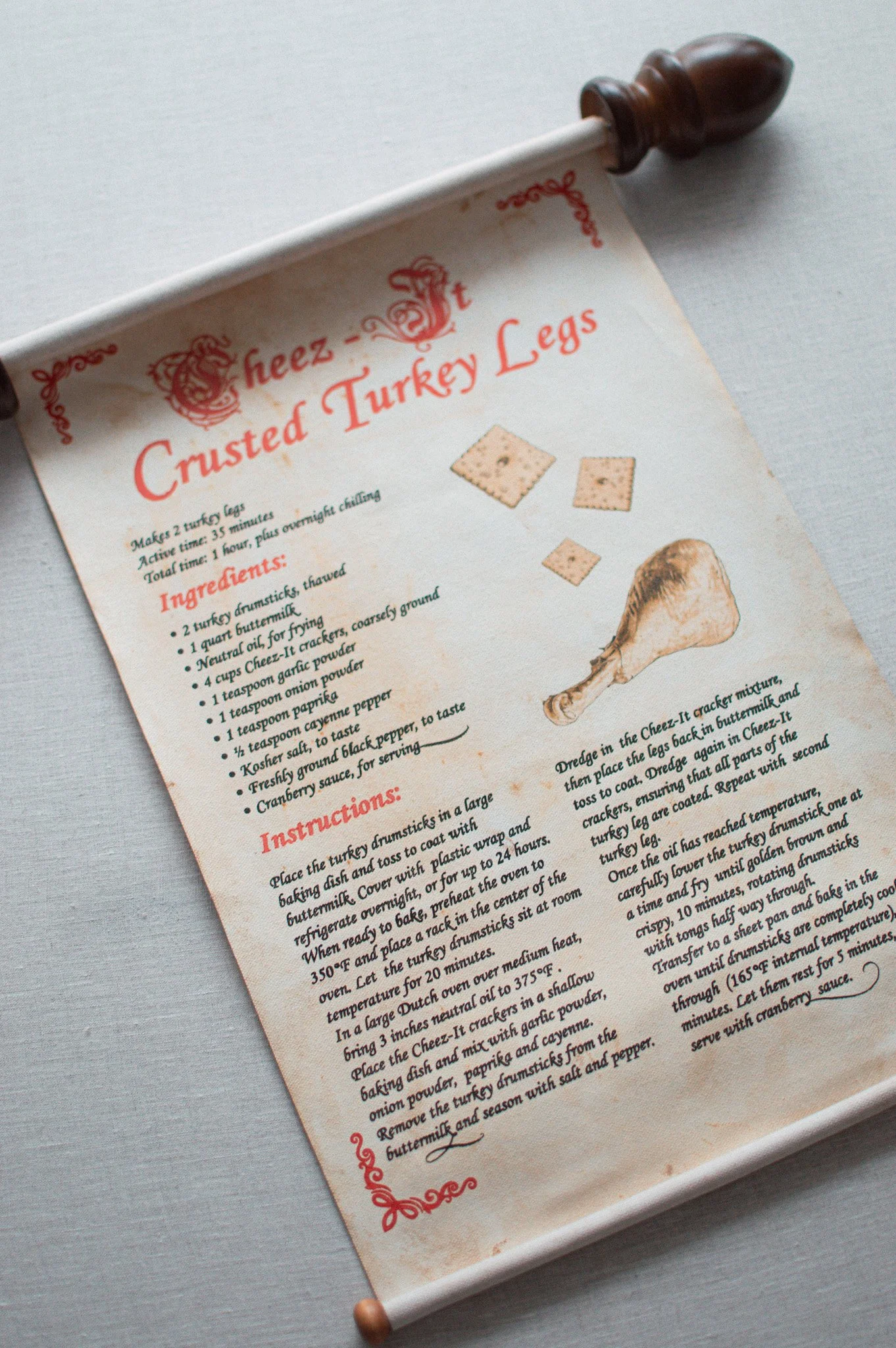 Hand-lettered scroll prop with custom aging and red calligraphy