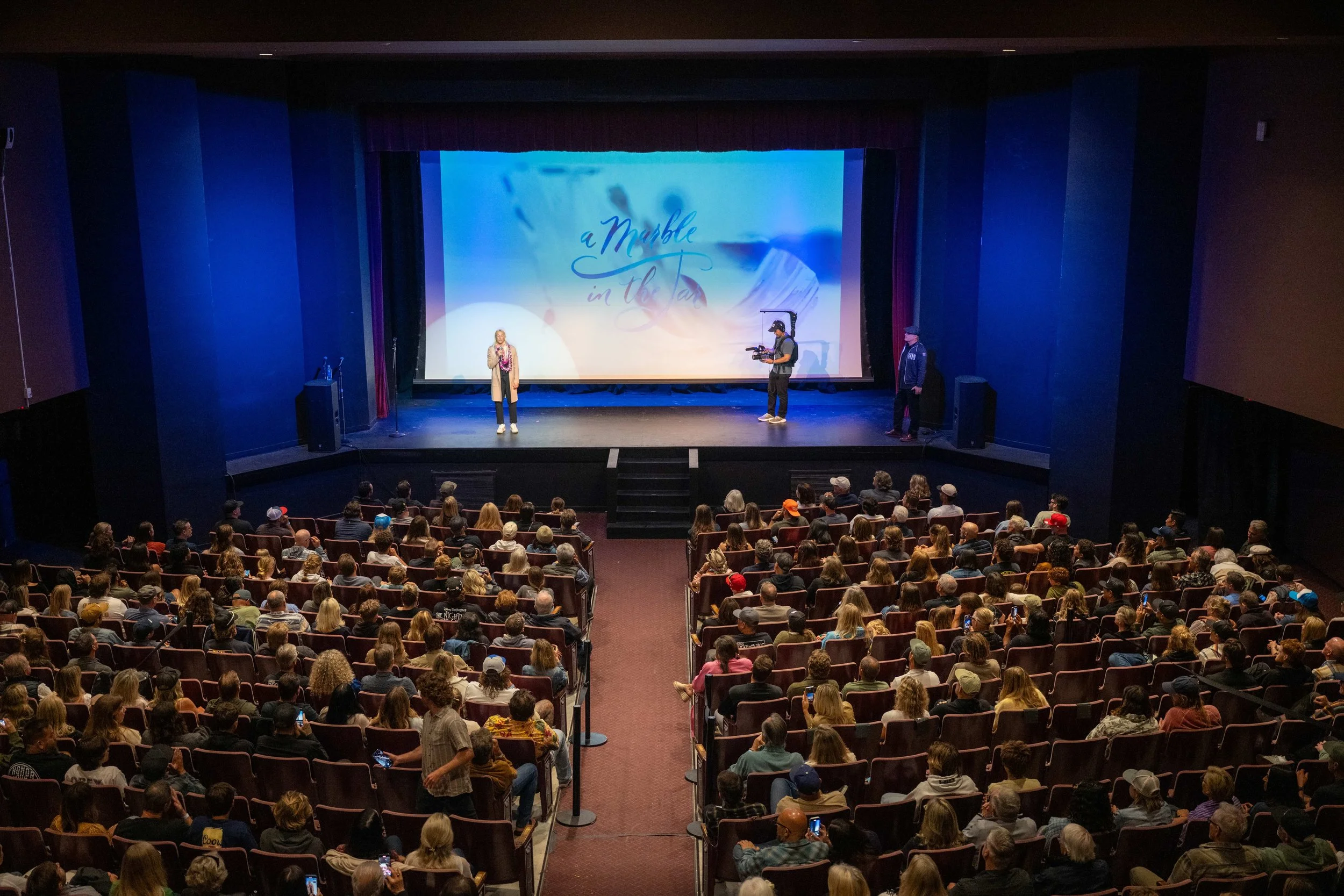 A Marble in the Jar title lettering projected at the Hermosa Beach premiere