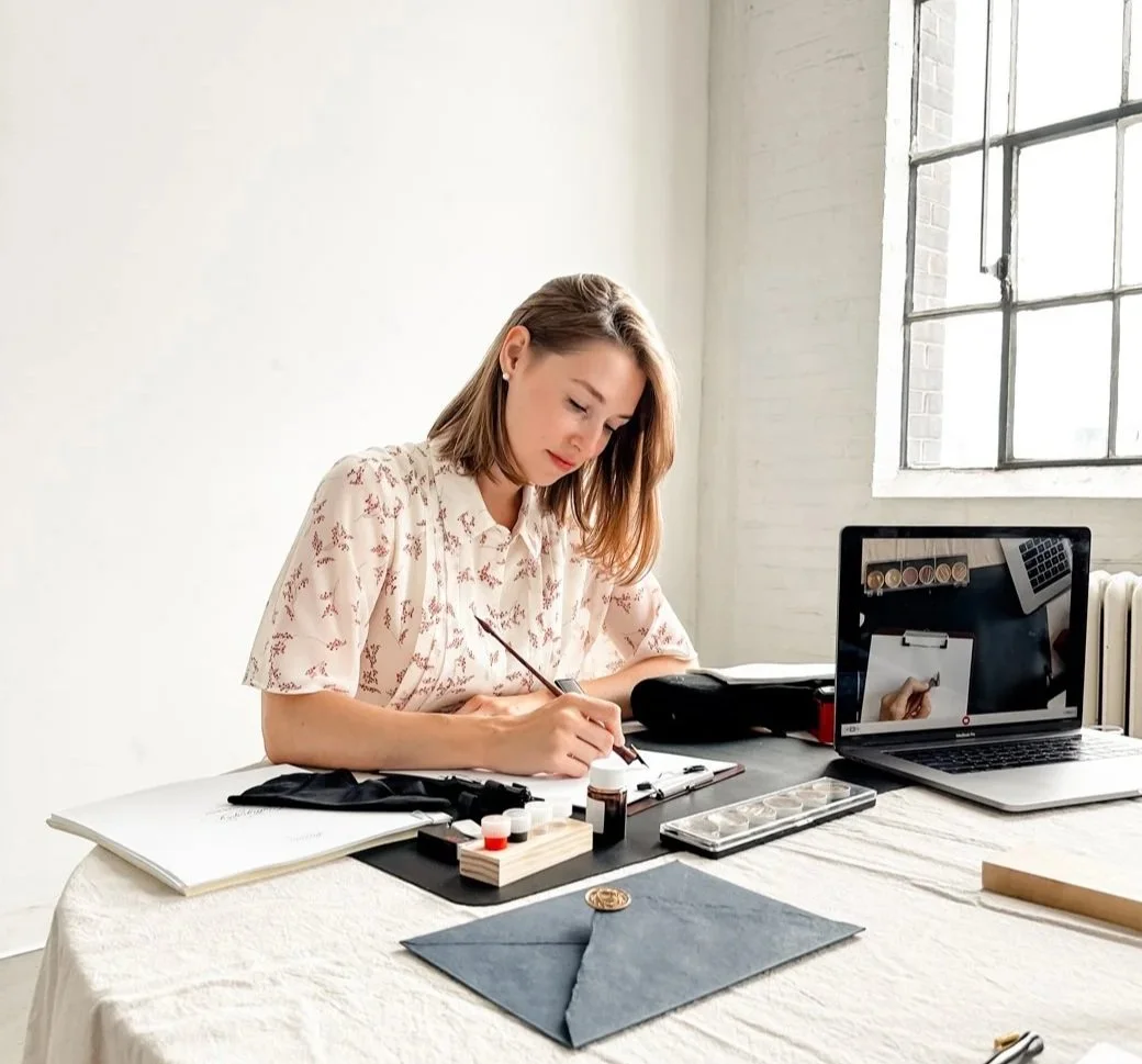 Valeria Danilova creating calligraphy in her Toronto studio