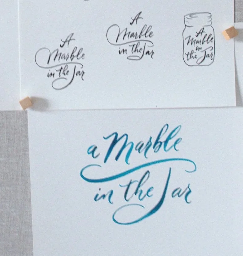 Aqua-blue watercolor lettering study with early marble jar sketch