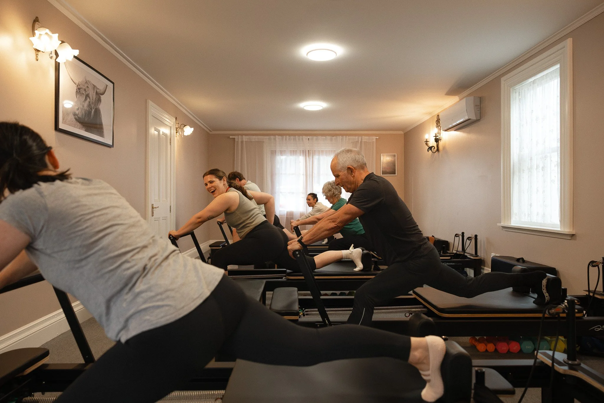 Pilates class at Wildling with clients on reformers