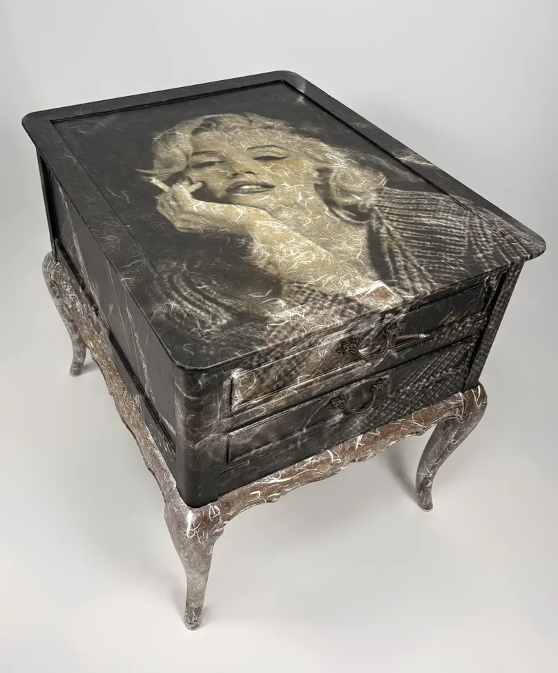 Decorative vintage-style wooden side table with curved legs, featuring a Marilyn Monroe portrait on its top surface.