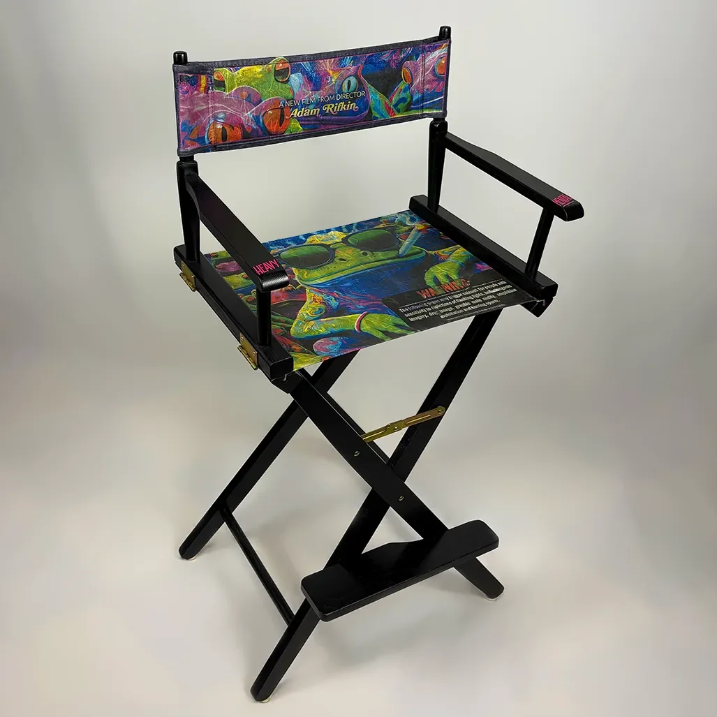 Colorful director's chair featuring a vibrant framed image of a psychedelic frog design - handcrafted decoupage print of "TOAD" movie poster - on the fabric, with black wooden frame and armrests.