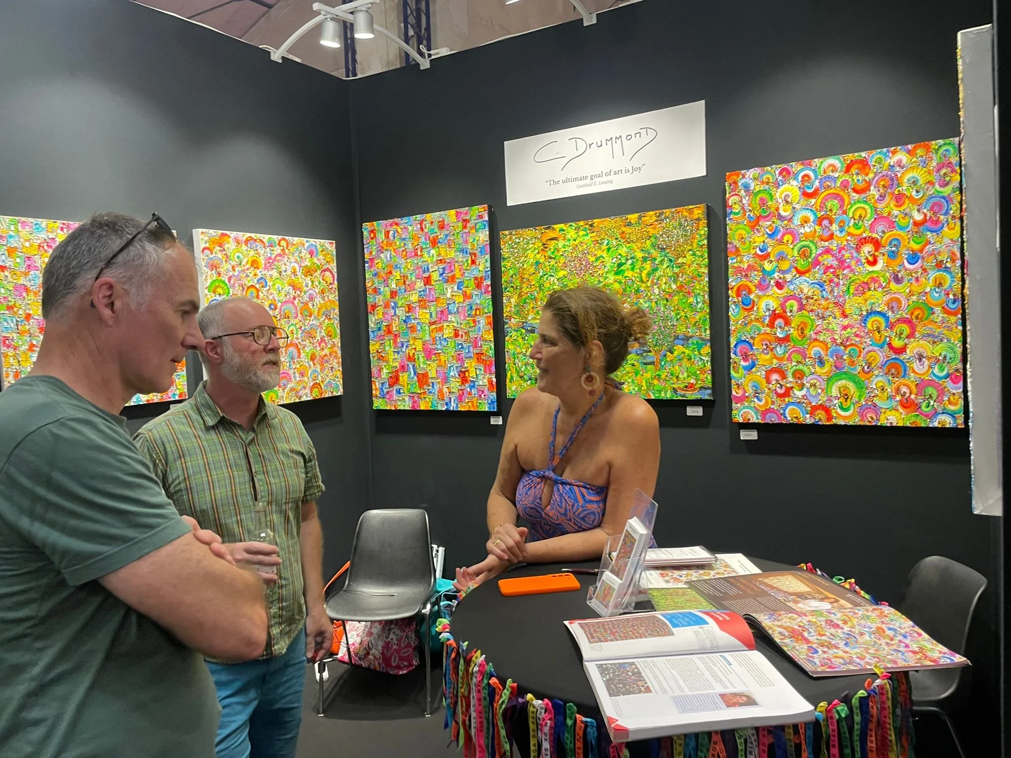 Artist Christine Drummond presenting her Brazilian-inspired paintings to visitors at Expo4Art Paris 2026.