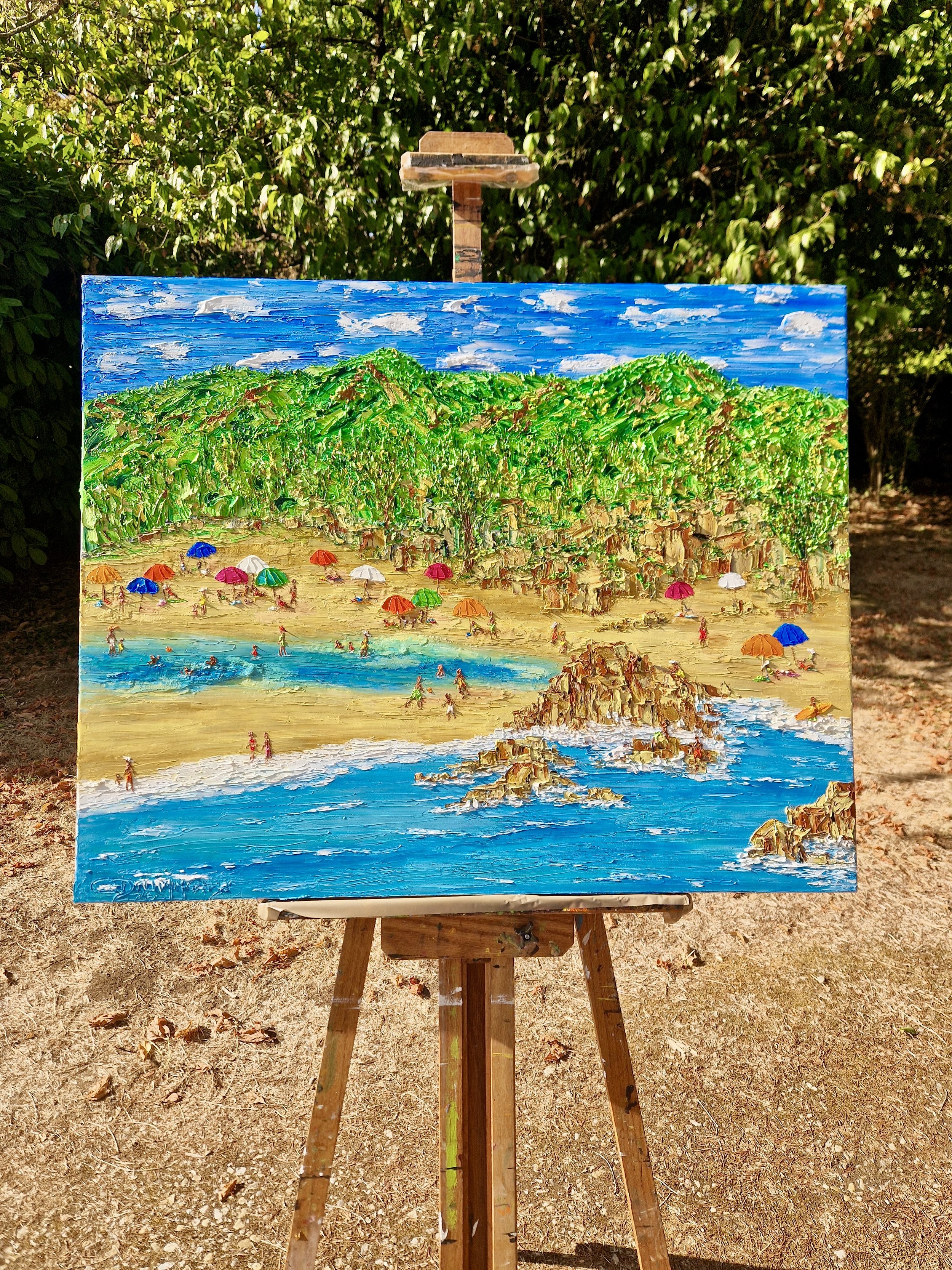 Partiu Grumari! by Christine Drummond displayed on an easel outdoors, an original colorful palette knife painting inspired by Grumari Beach in Rio de Janeiro.