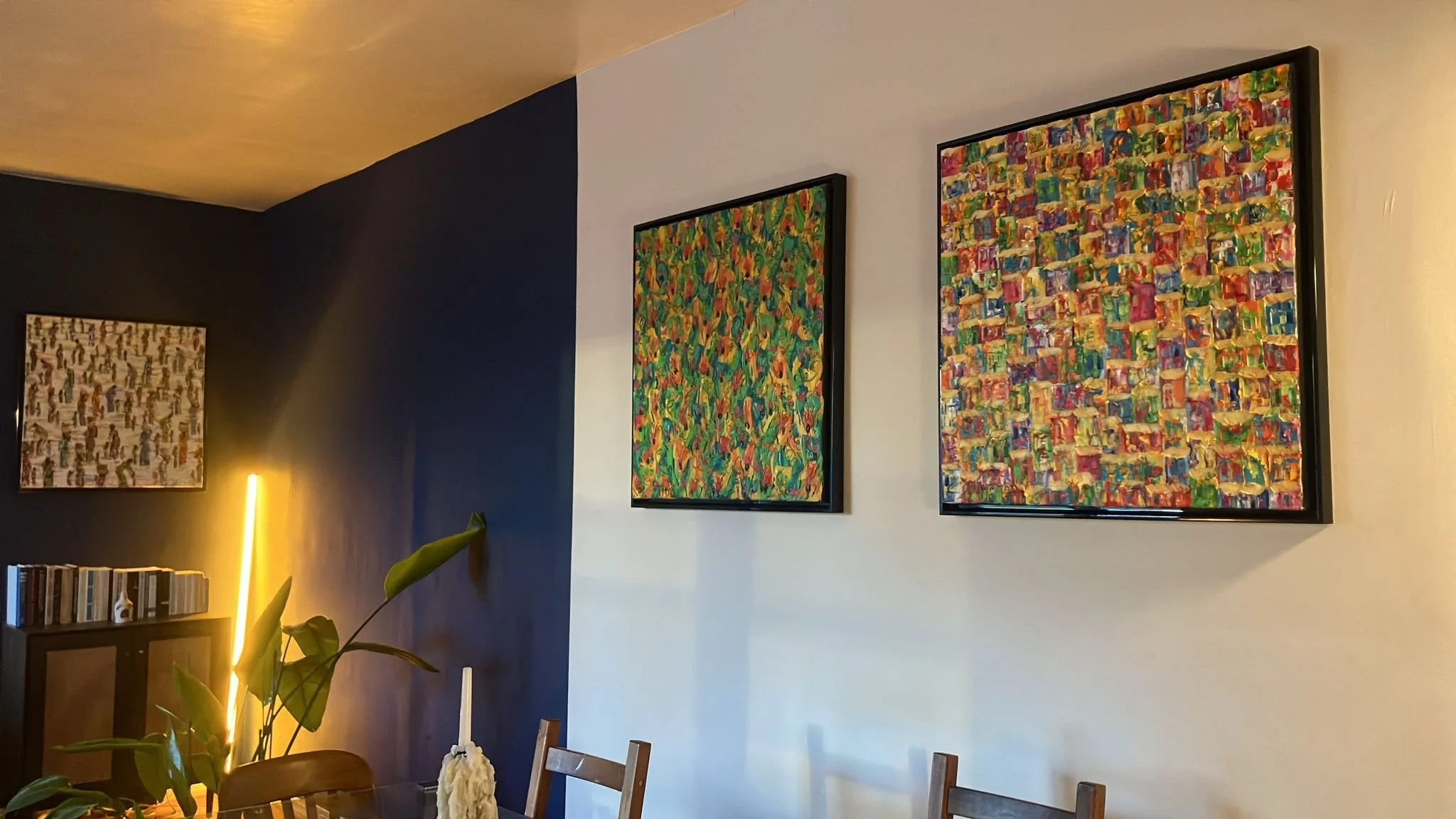 Christine Drummond favela paintings displayed in elegant contemporary dining room in New York City