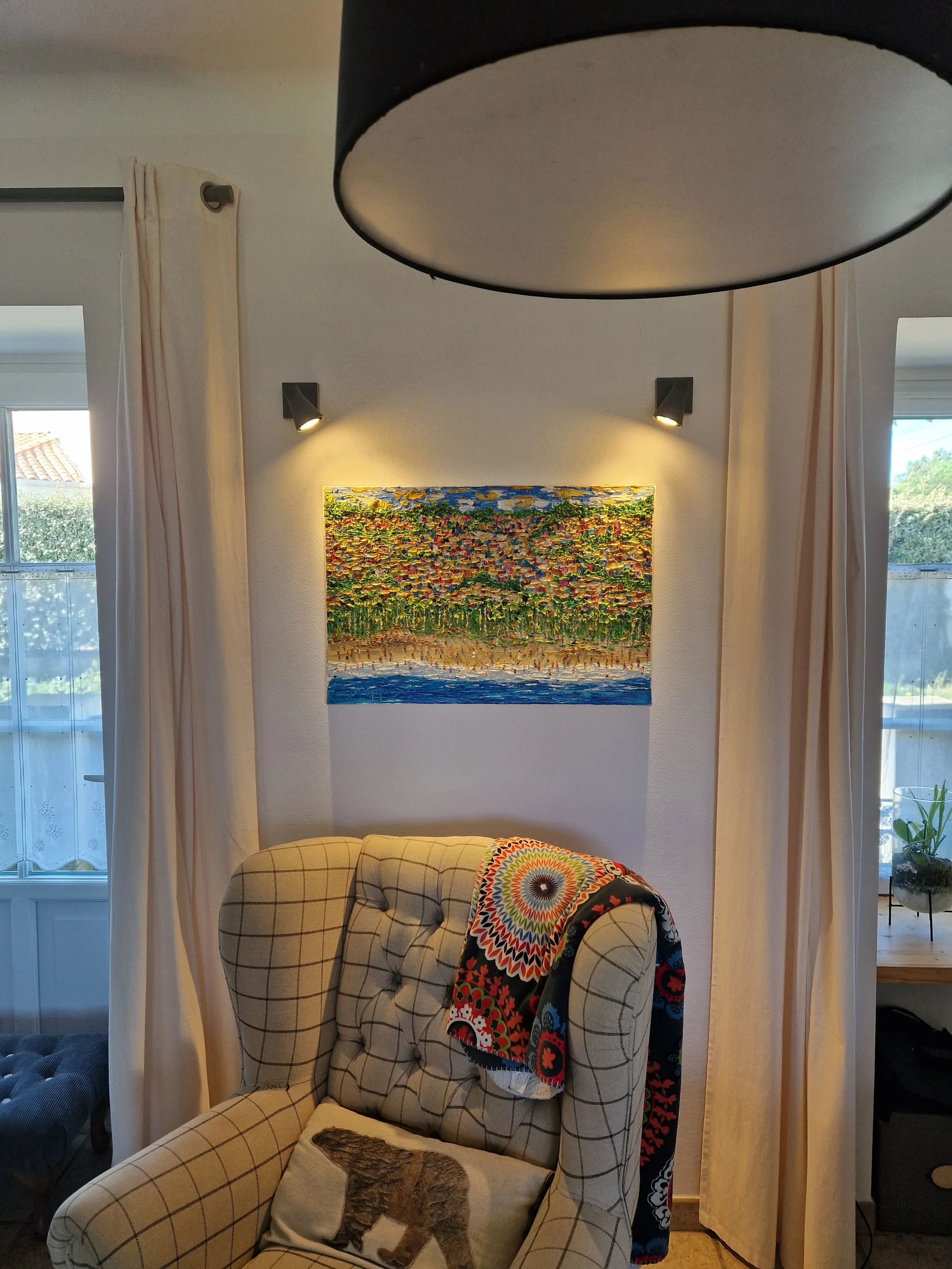 Christine Drummond beach painting displayed in elegant coastal home interior in South Brittany, France with warm gallery lighting and contemporary decor