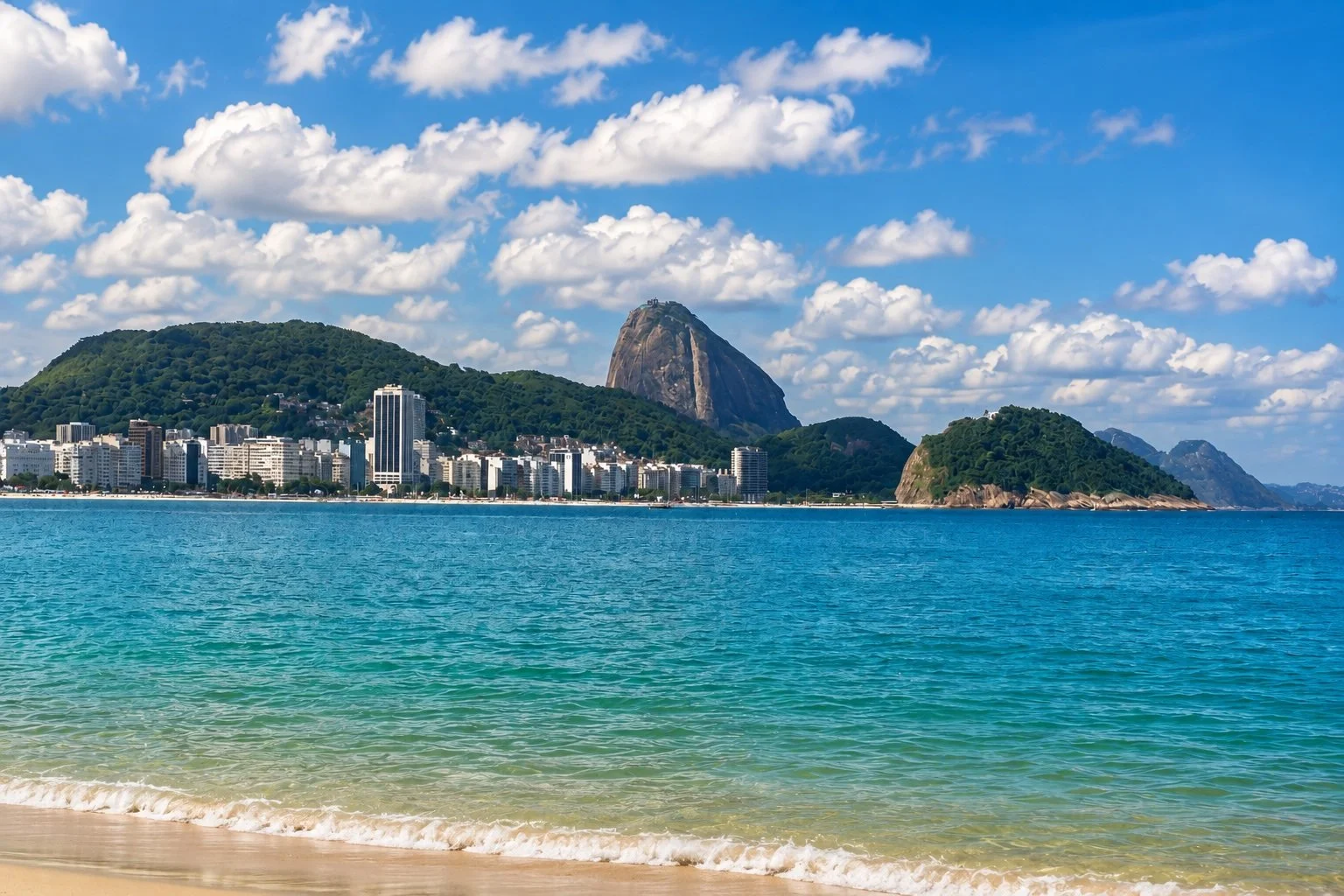 View of Rio de Janeiro with Sugarloaf Mountain, turquoise waters and sandy beach, the city that continues to inspire the colourful palette knife paintings of Franco-Brazilian artist Christine Drummond.