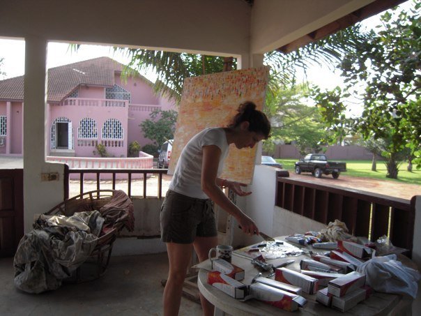 Christine Drummond painting in Accra, Ghana, during her artistic experience alongside Prof. Ablade Glover in 2009