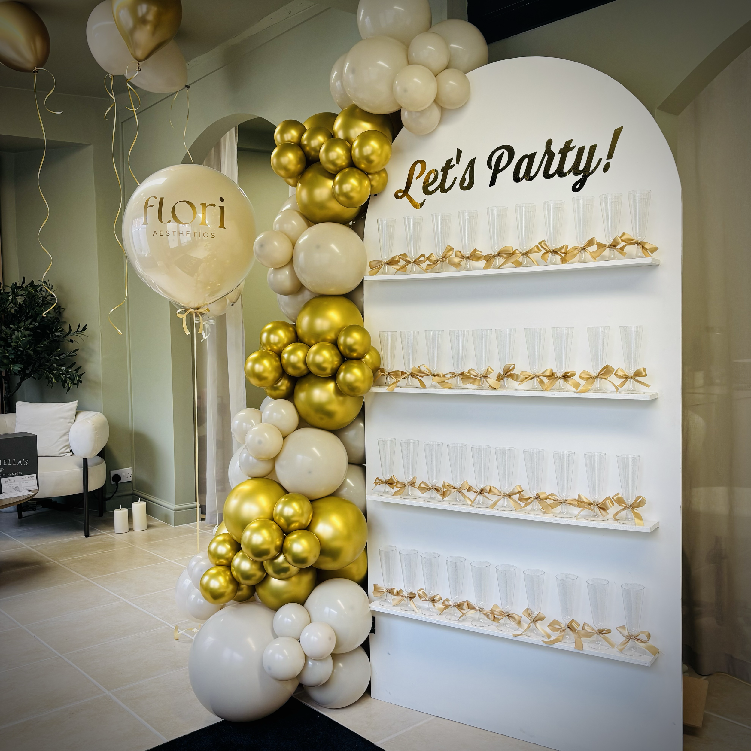 Prosecco Wall with balloon decoration supplied for Flori Aesthetics in Peterborough