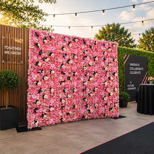 Pink Flower Wall for a corporate event in Cambridge supplied with light up letters 