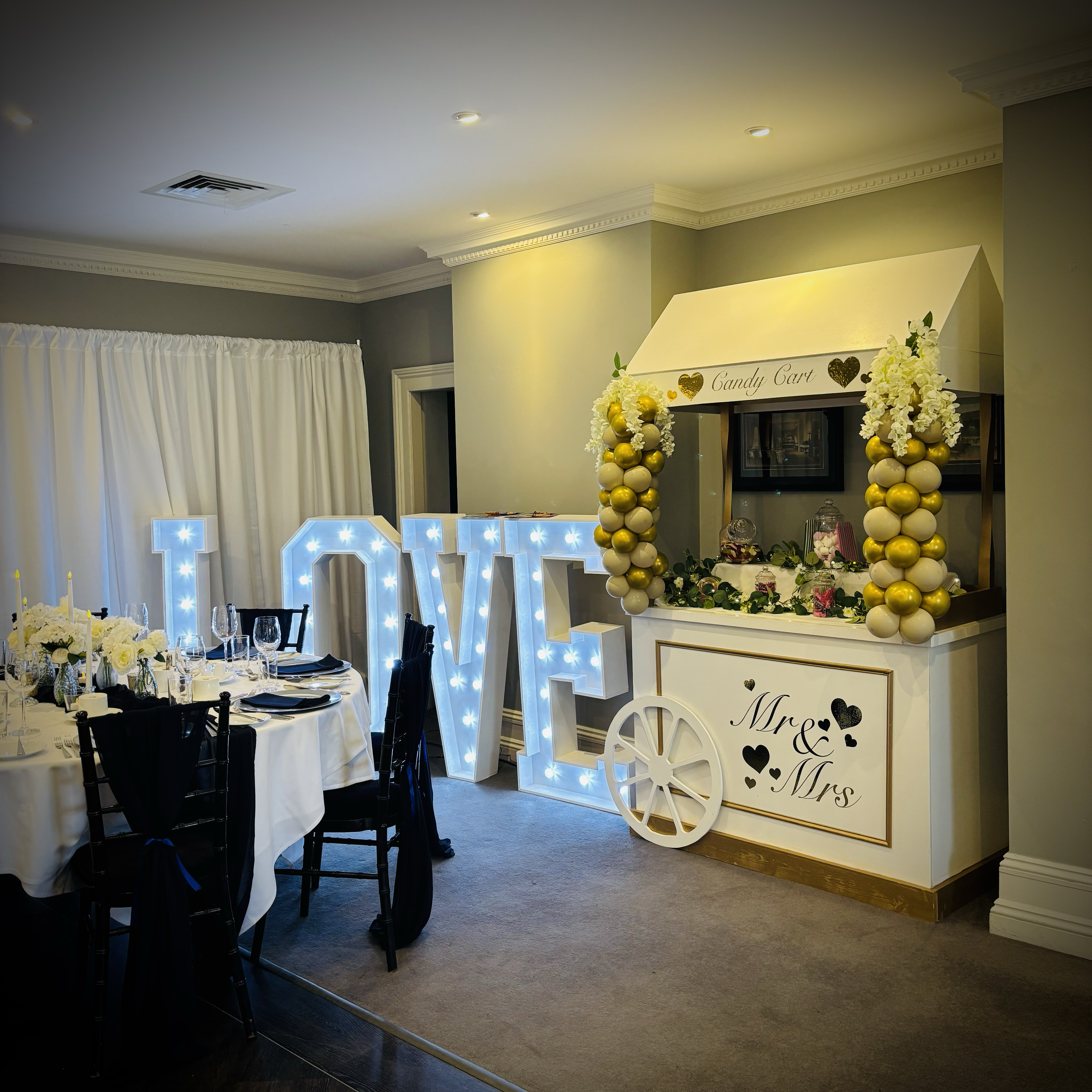 4ft light up LOVE letters with wedding themed Candy cart.