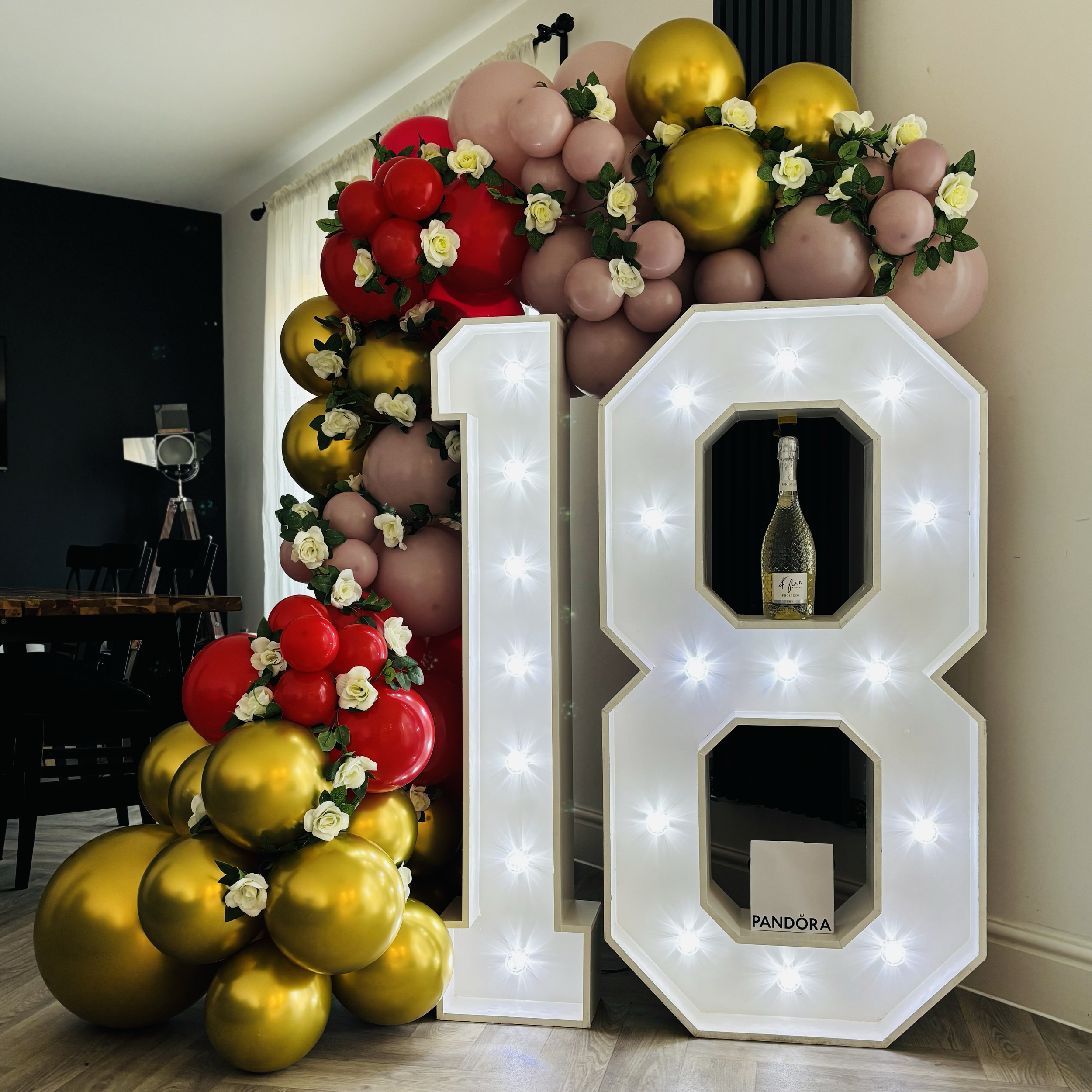 18th Birthday set up with 4ft light up 18, balloon decoration and faux florals.