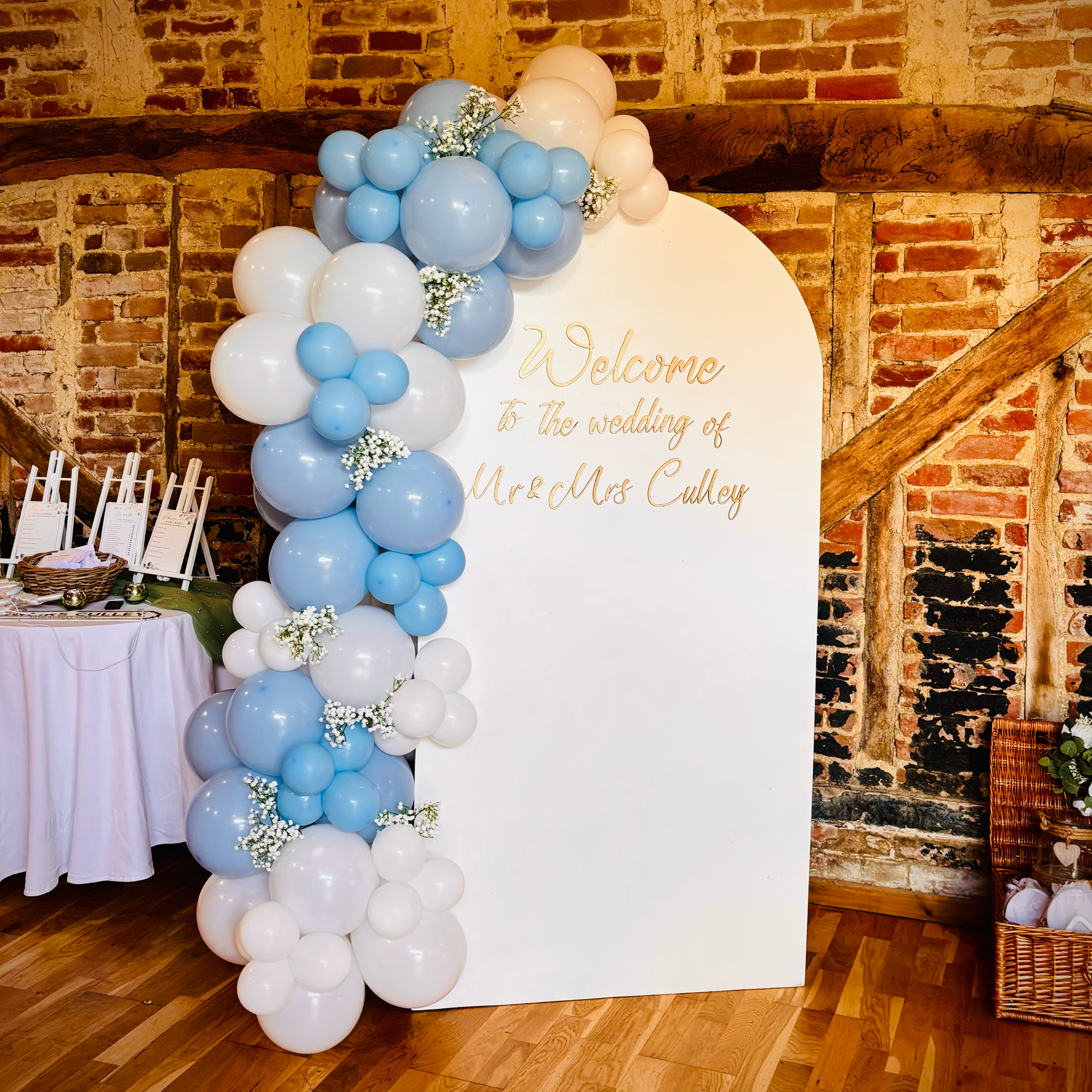 Welcome Sign with balloon and faux floral decor 