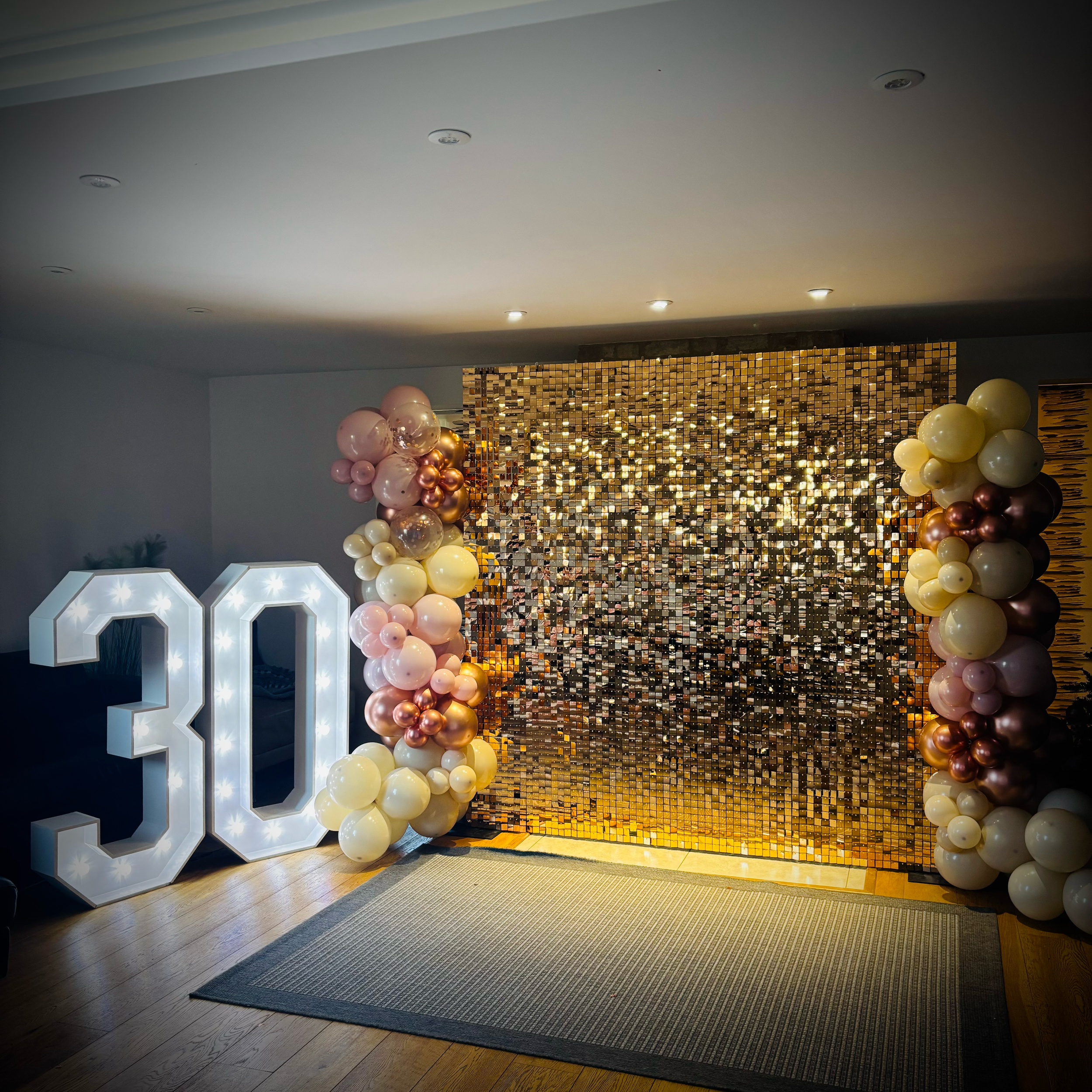 Rose Gold Shimmer Wall with Balloon Decor and 4ft Light Up "30" for a Party in Wilburton, Cambridge