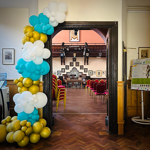 Teal, gold and white balloon arch for Stephen Perse School Prom at Cambridge Union 