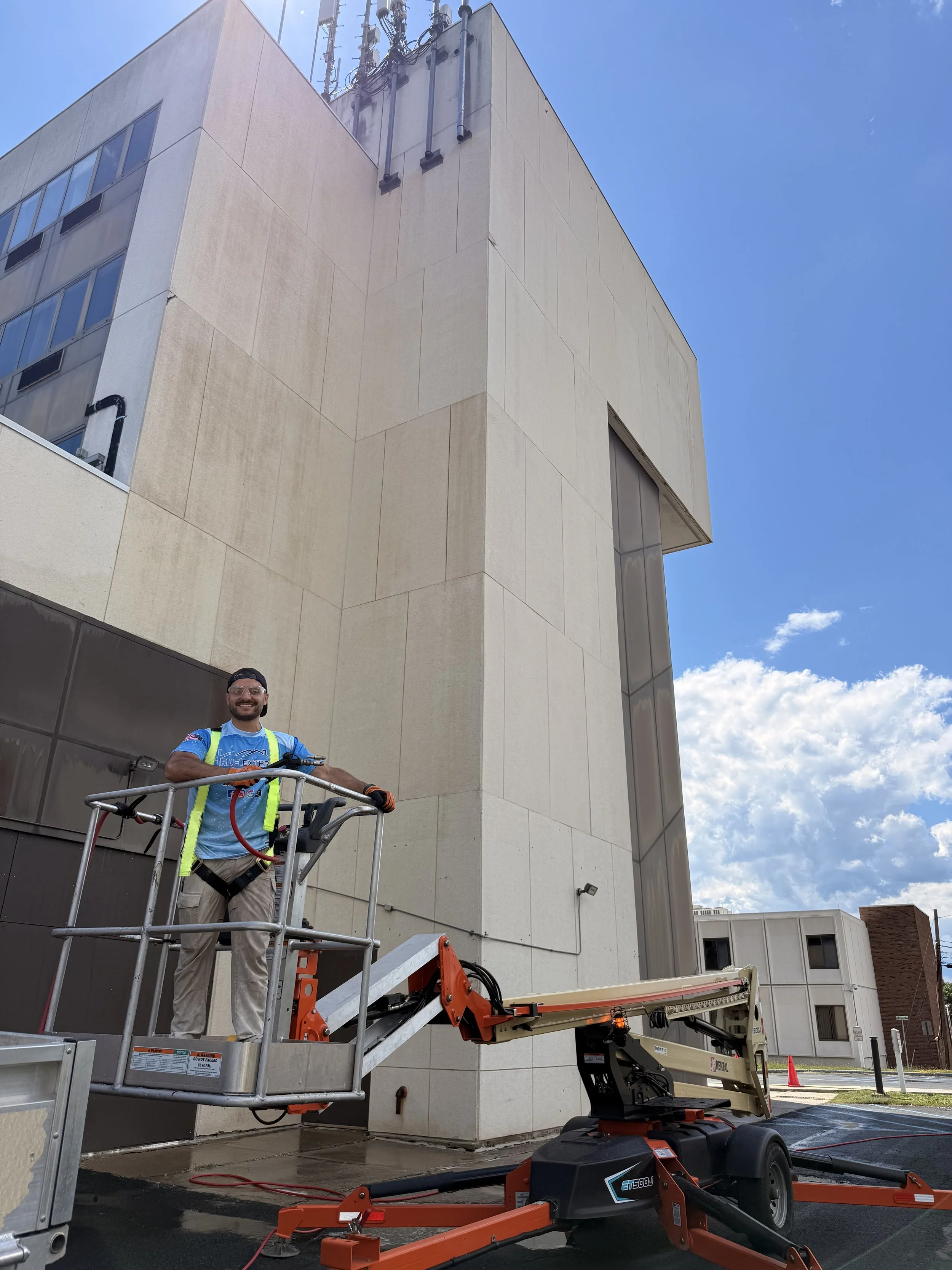Power Washing/ soft washing a commercial property in Orange County, NY removing years of mold from the college building.
