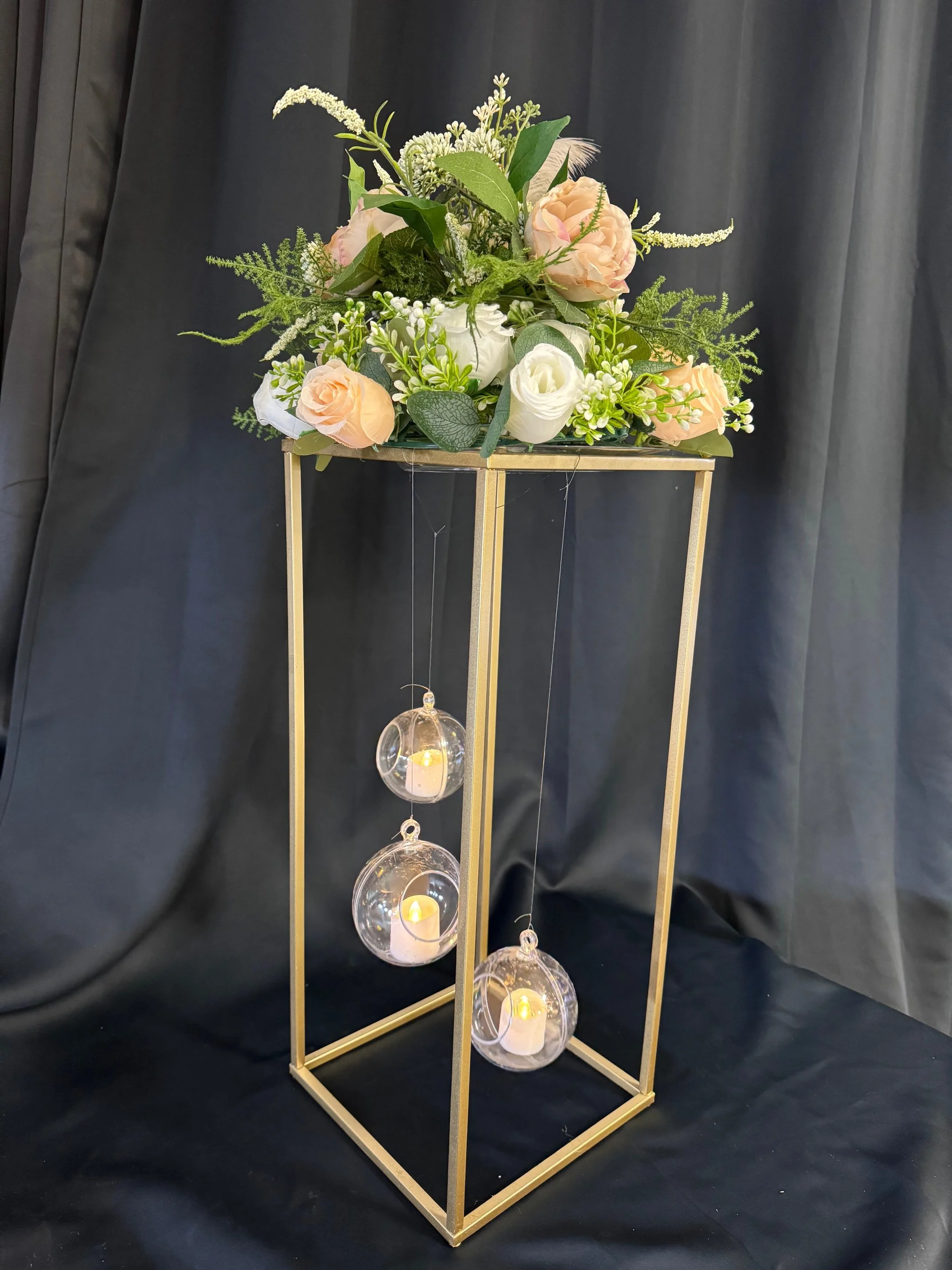 Gold Table Stands with lights and florals