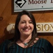 A background with a light gray topographical map pattern featuring curved contour lines.