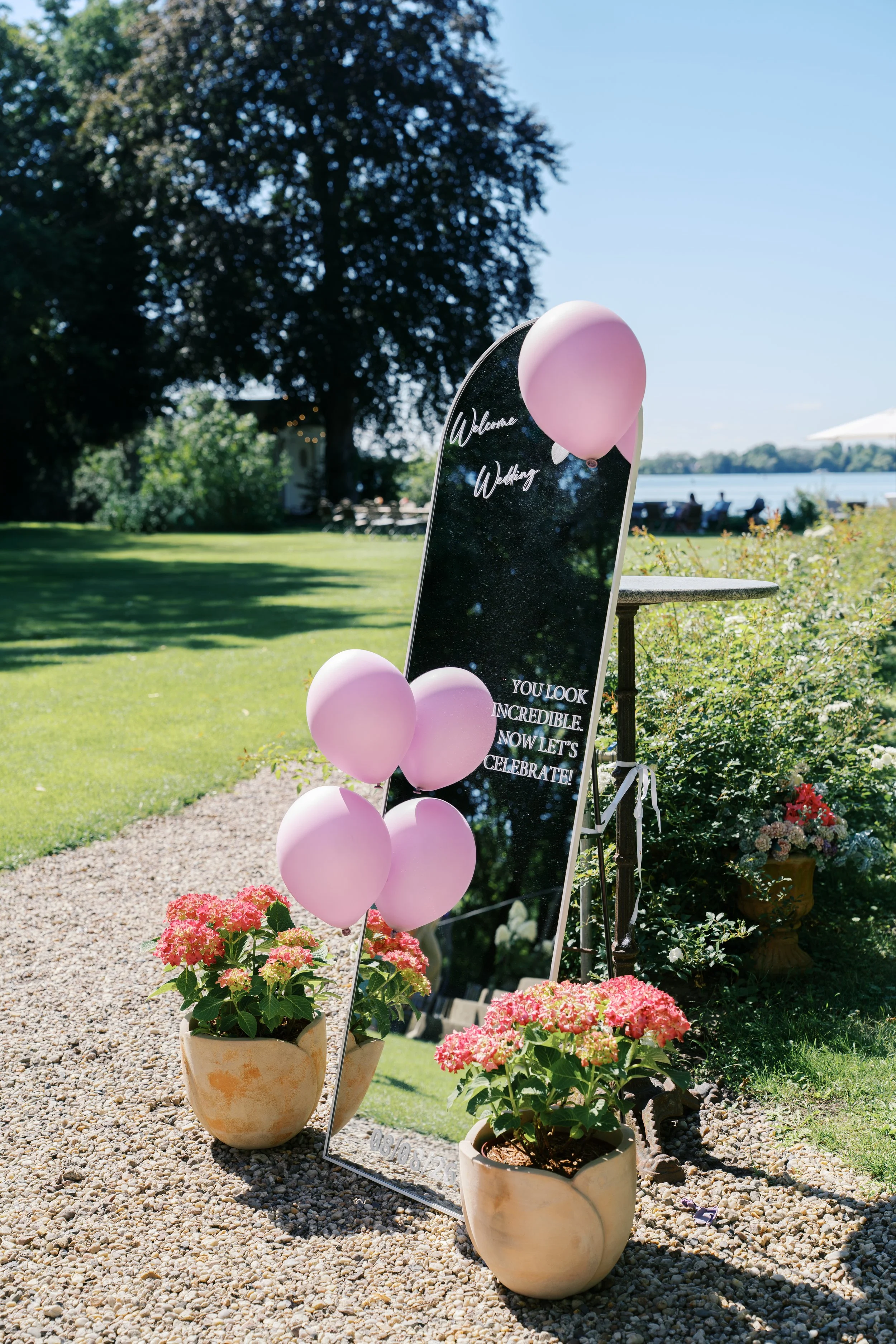 Mirror welcome sign for a Gut Schloss Golm wedding by the water