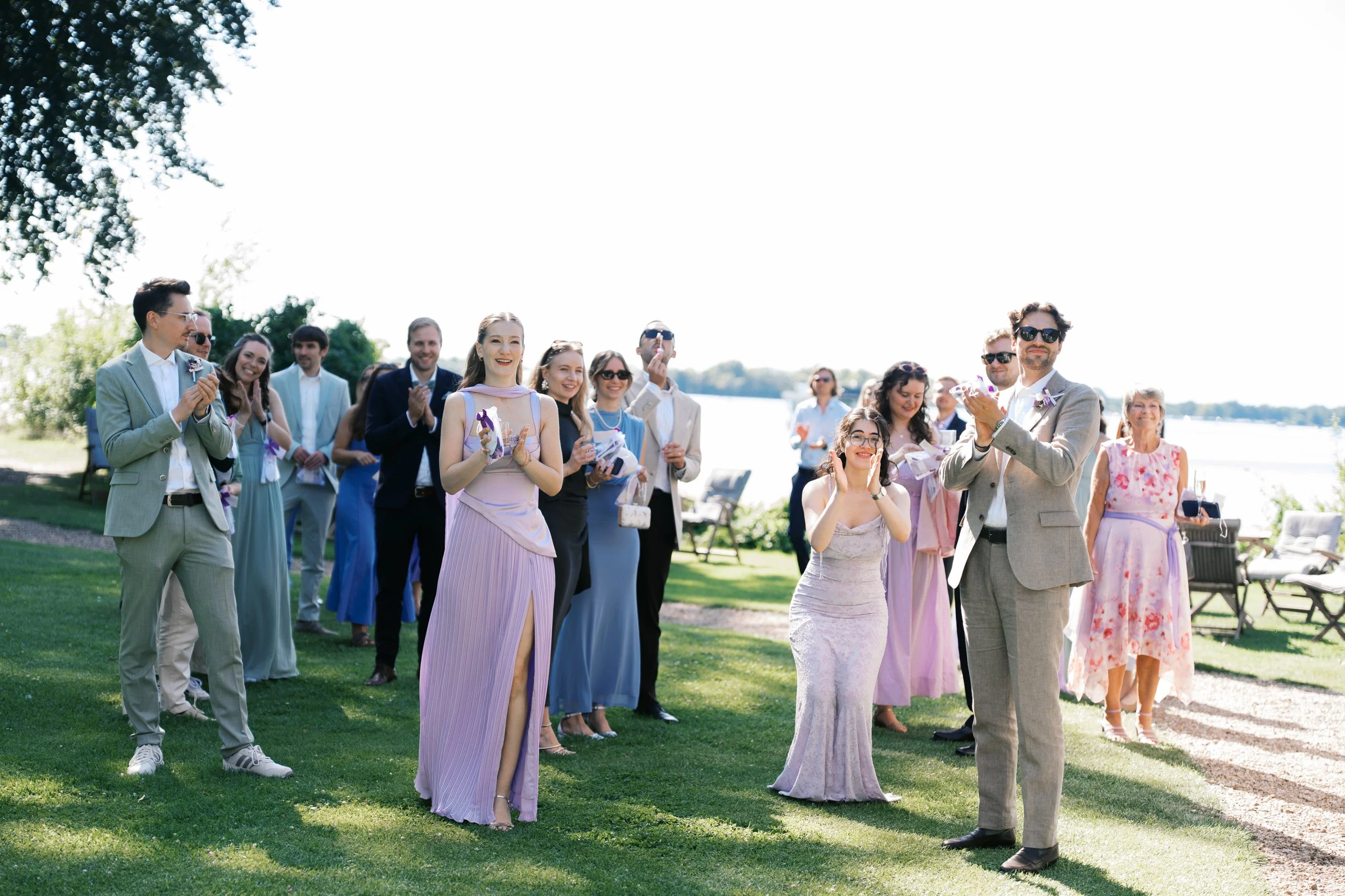 Guests clapping and celebrating bride and groom at a Gut Schloss Golm wedding