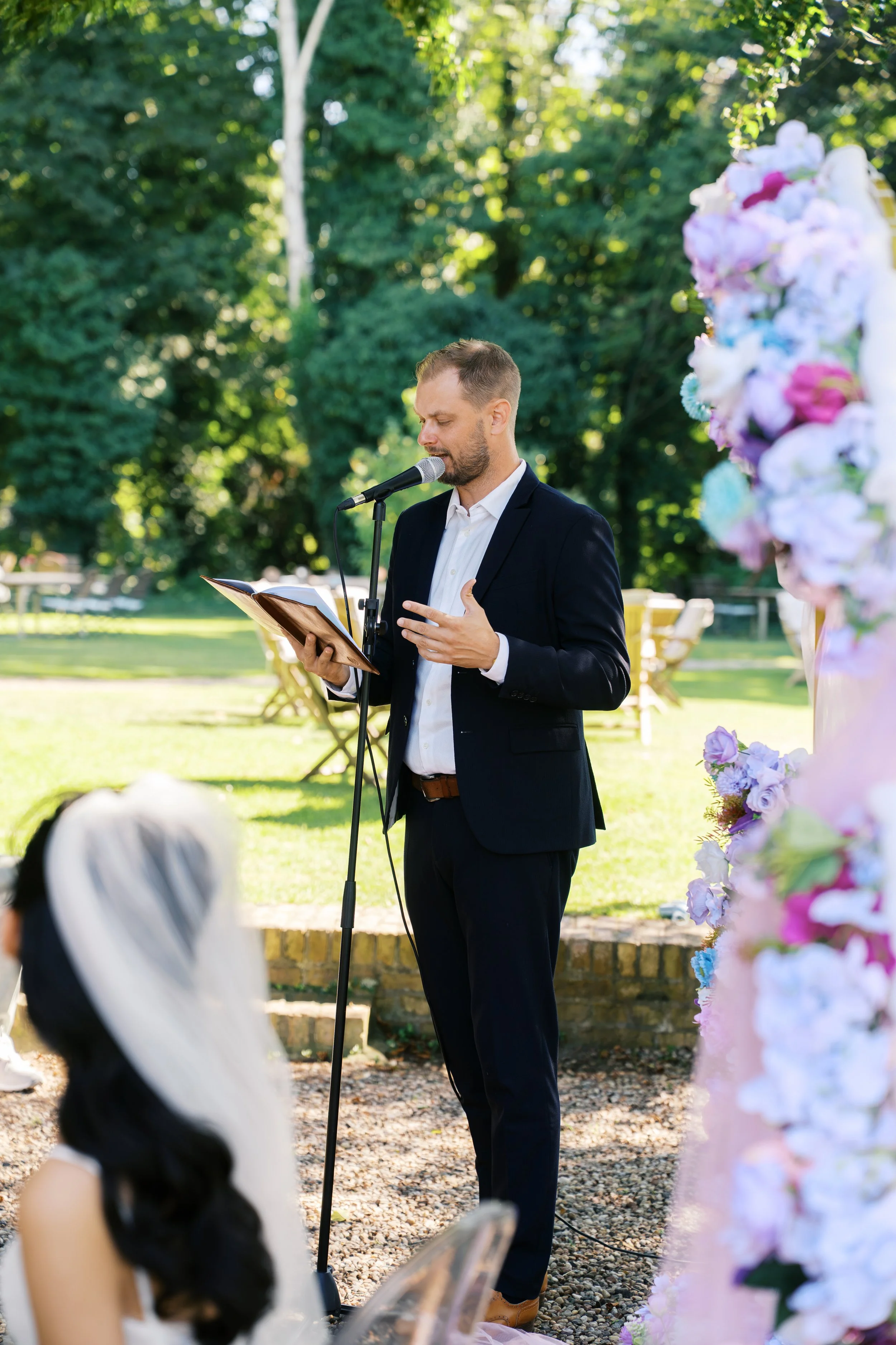 Wedding officiant giving a speech at a ceremony at Gut Schloss Golm