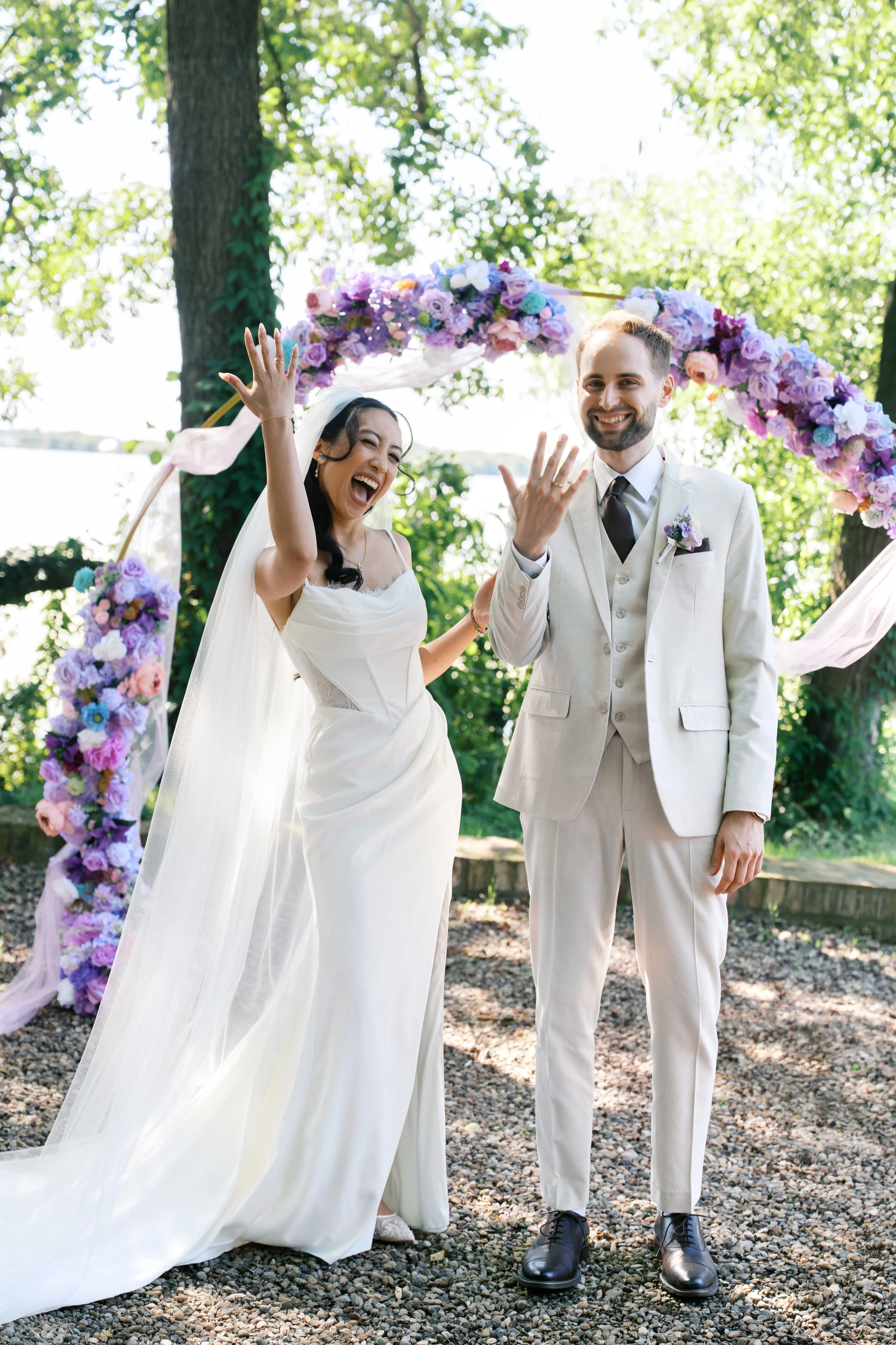 Bride and groom celebrating at the end of the ceremony by showing off their rings at Gut Schloss Golm in Potsdam