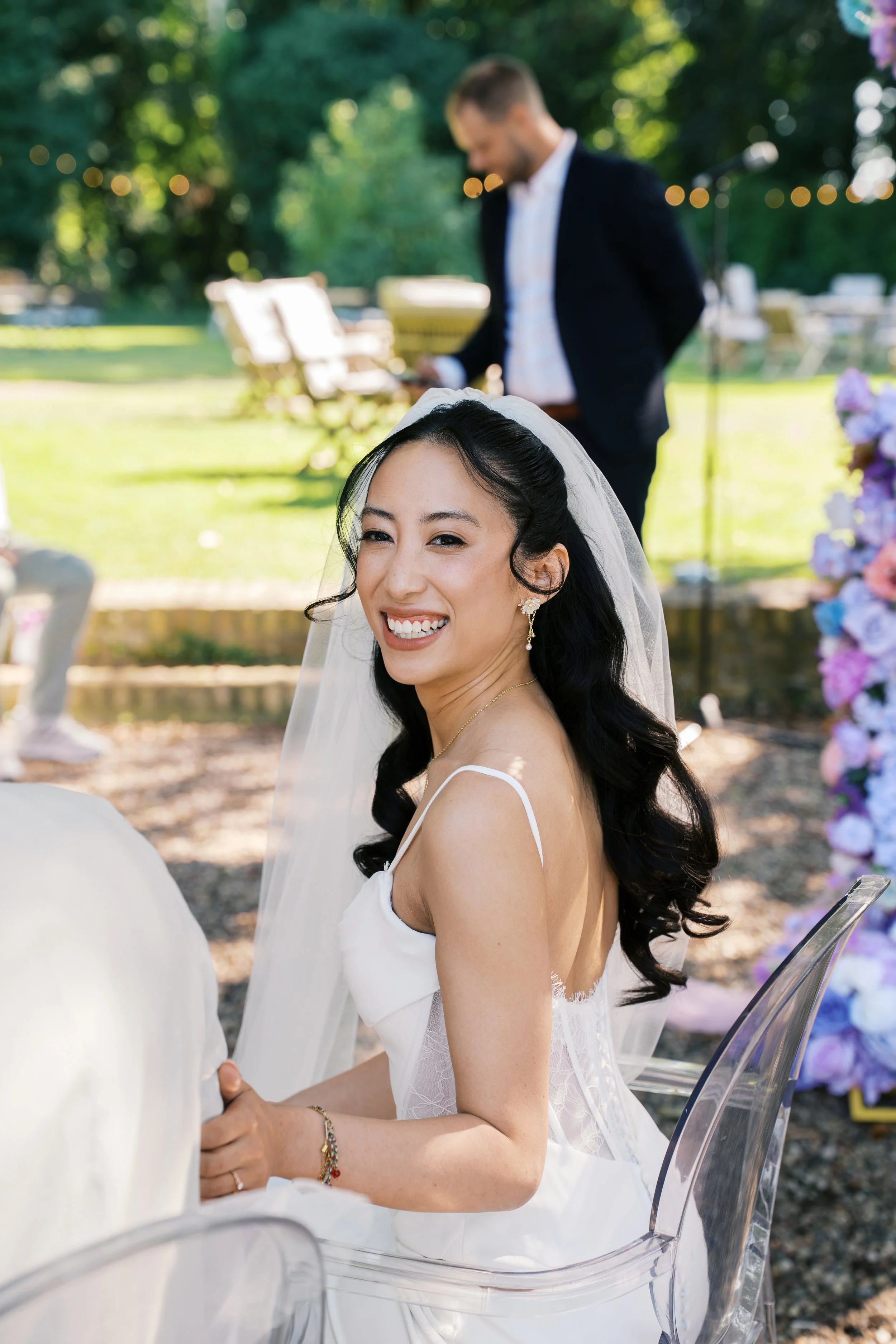 Bride looking over her shoulder and smiling at a Gut Schloss Golm outdoor wedding