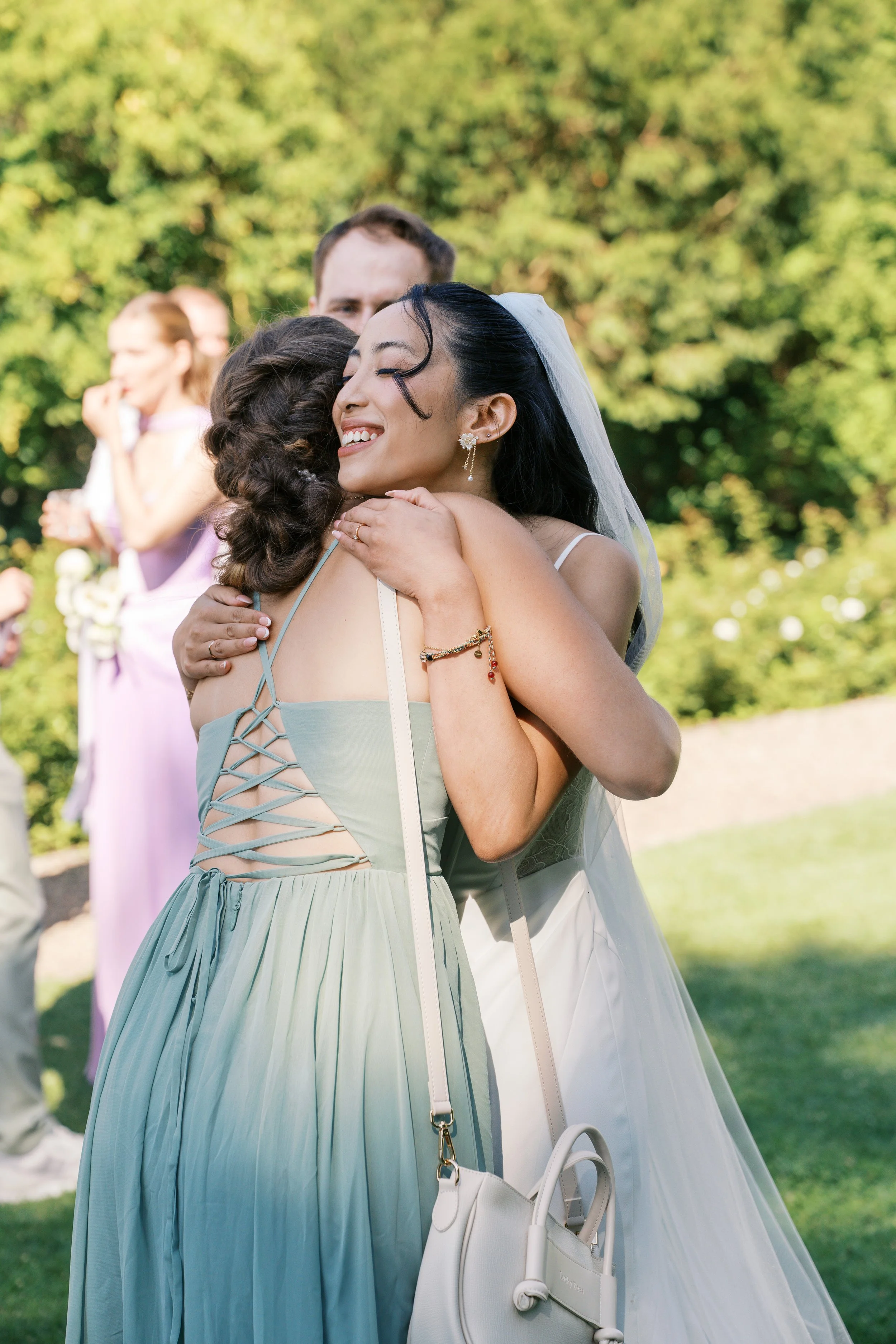 Bride hugging her guest outside at Gut Schloss Golm