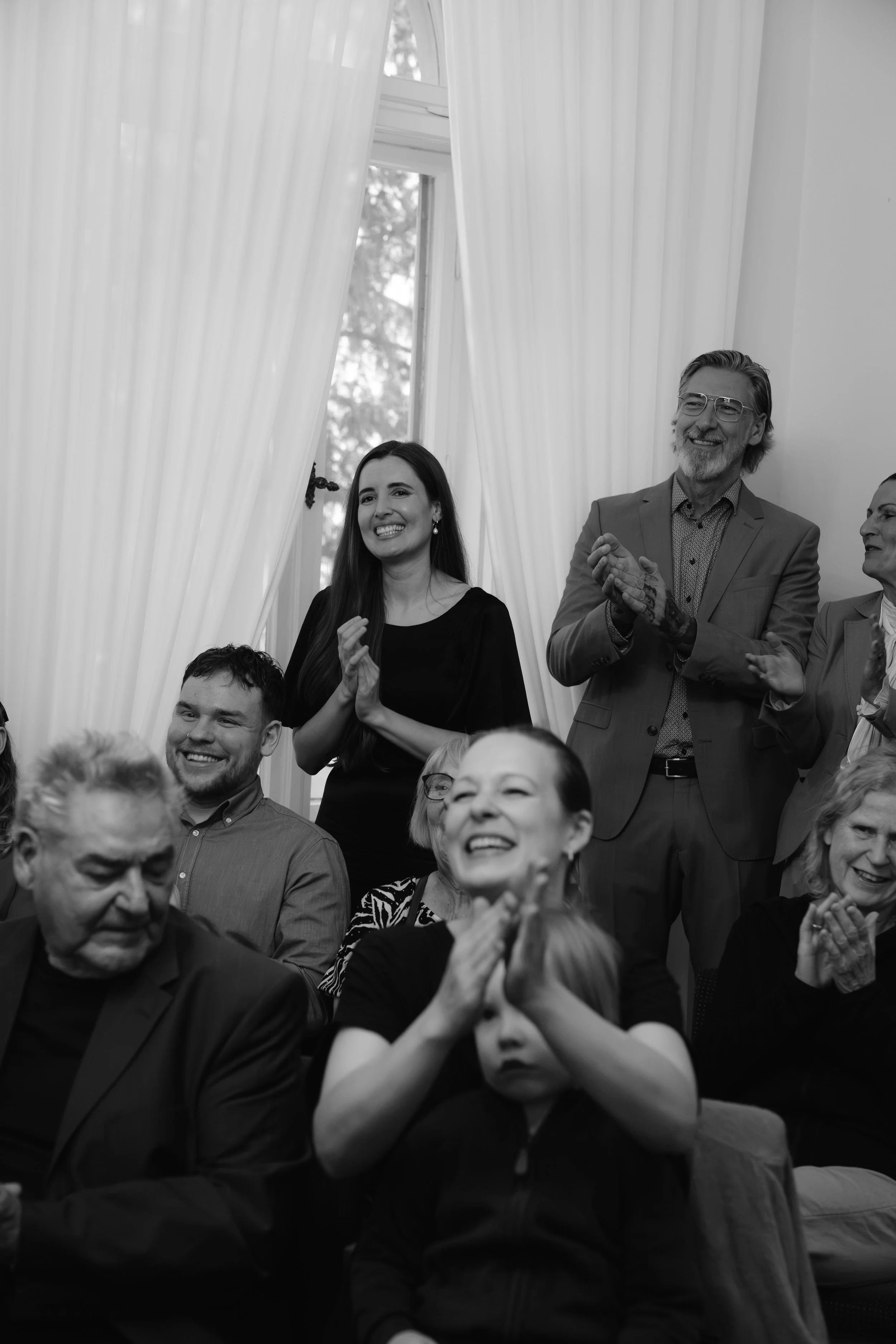 Guests clap during a ceremony at Hochzeitsvilla in Berlin