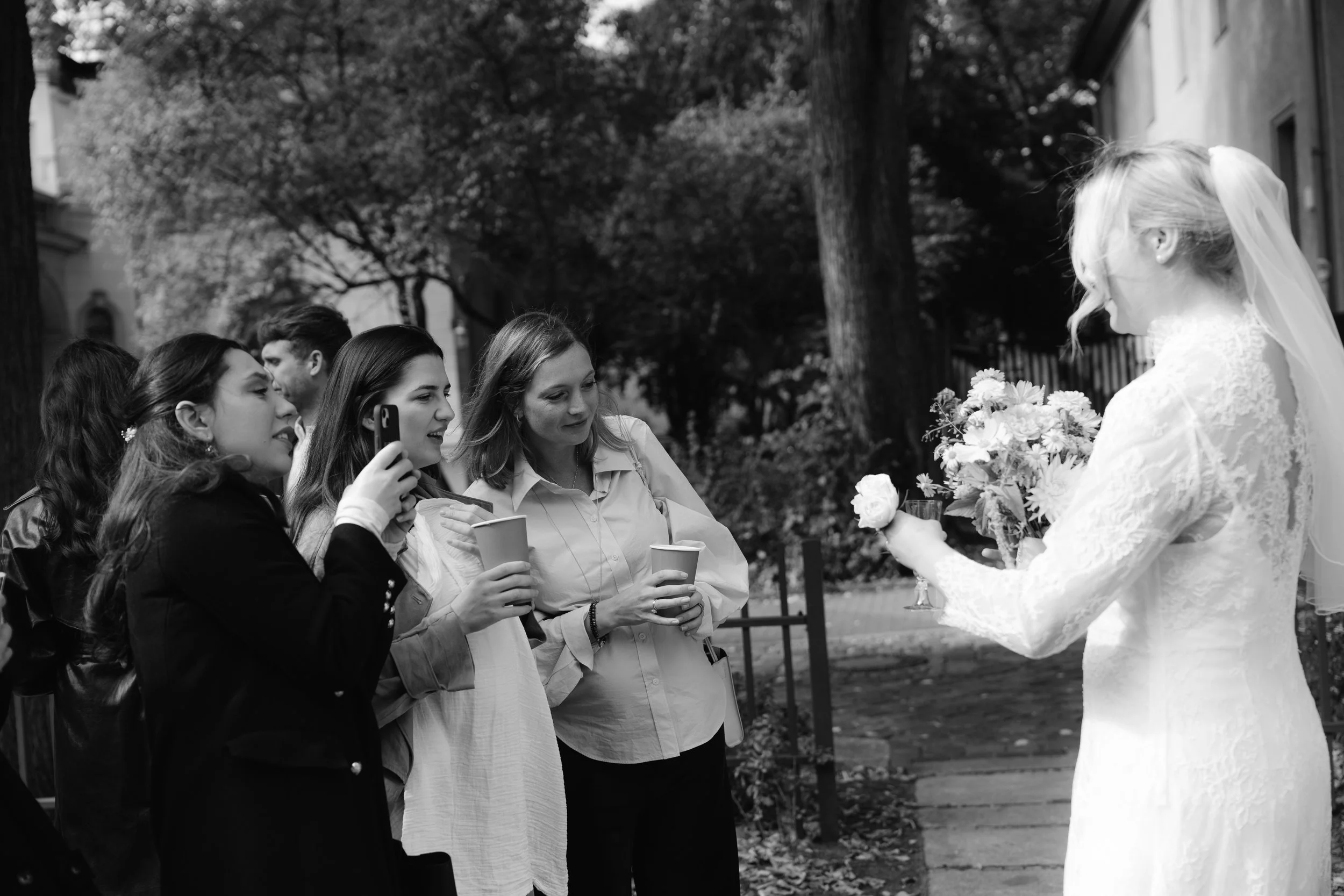 Bride showing her ring to her friends outside of Hochzeitsvilla in Berlin