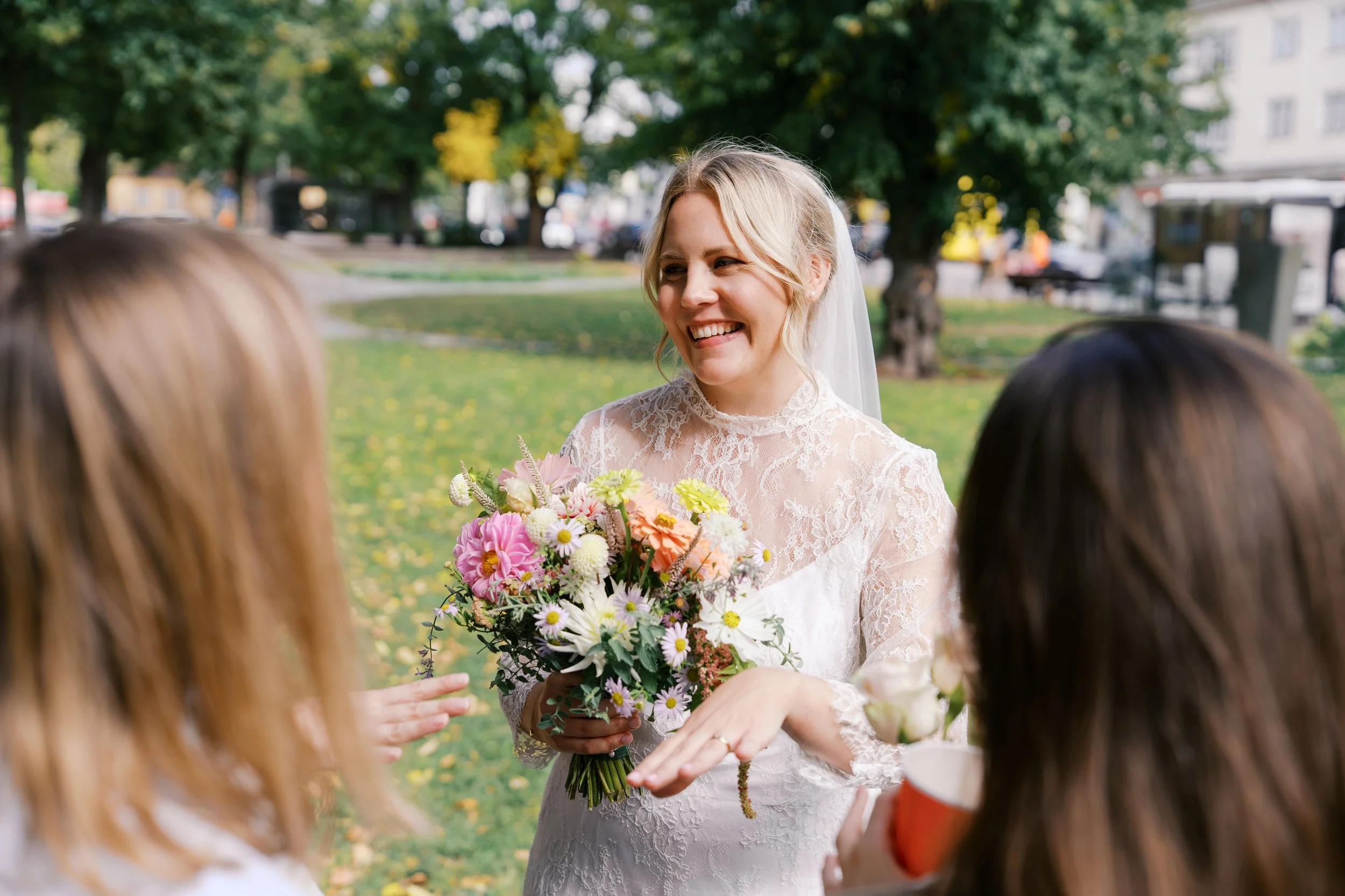 Bride smiling at guests outside of Hochzeitsvilla in Berlin