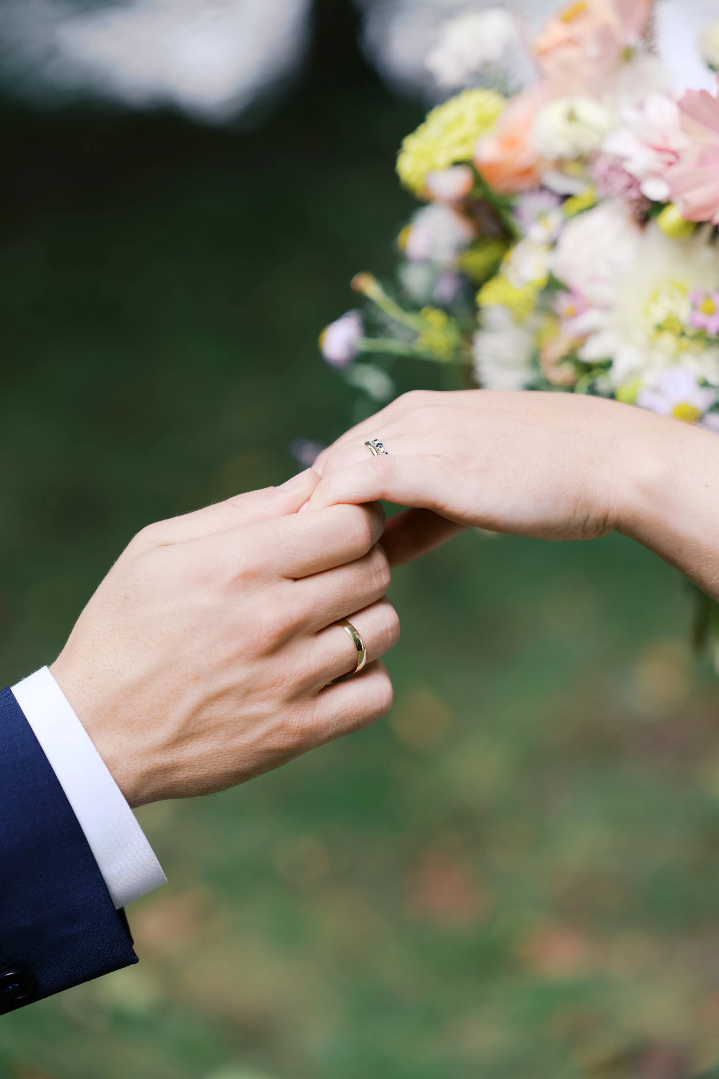 Bride and groom's hands with their rings on after their Hochzeitsvilla wedding