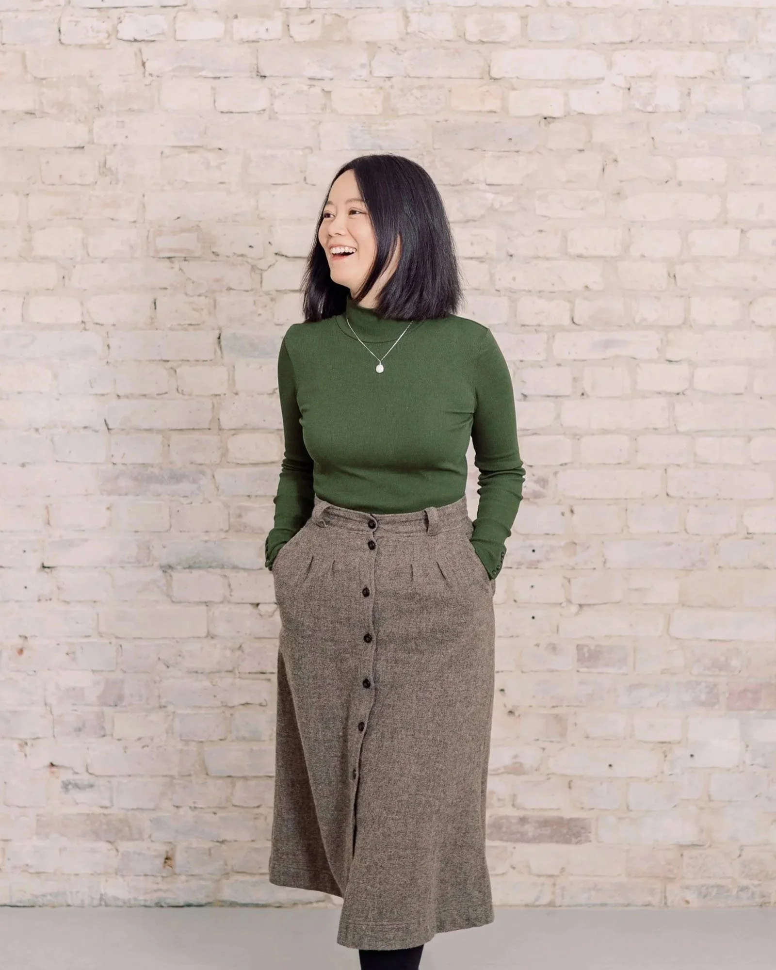 Wedding photographer in Germany, Duo Chen, smiling off to the side