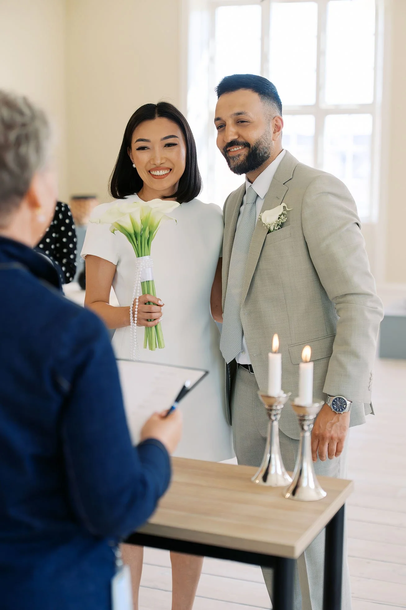 A couple getting married during a civil wedding ceremony in Thisted, Denmark. Shot by Duo Chen Photography.