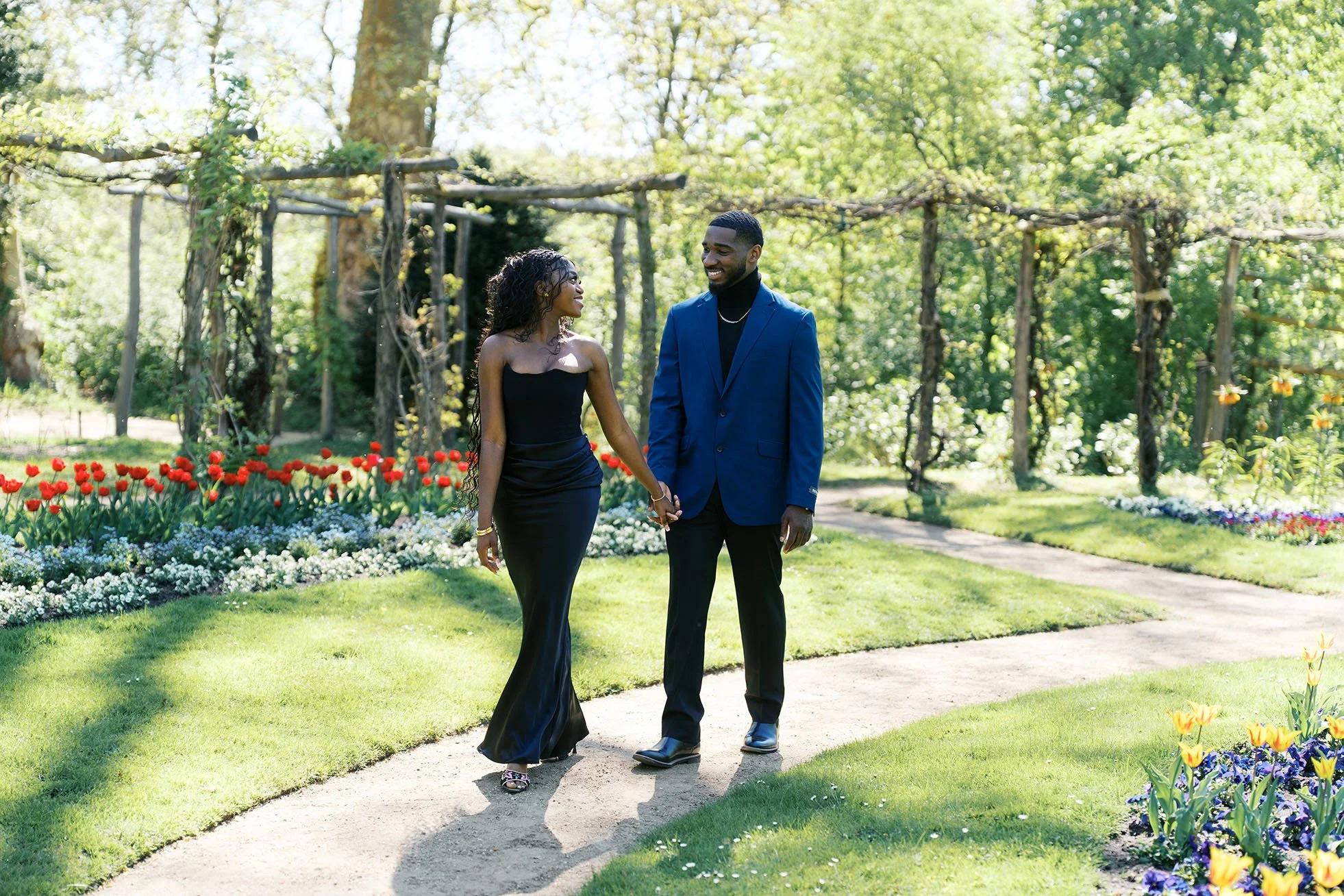 A beautiful portrait of an engagement in a rose garden on Berlin Peacock Island, captured by Duo Chen Photography.