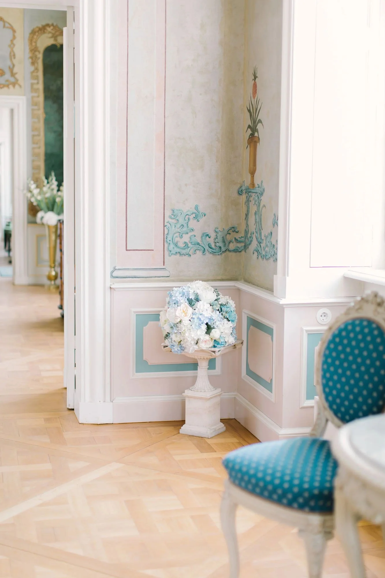 bouquet of flowers in the corner of a palace taken by wedding photographer in Berlin, Germany, Duo Chen Photography