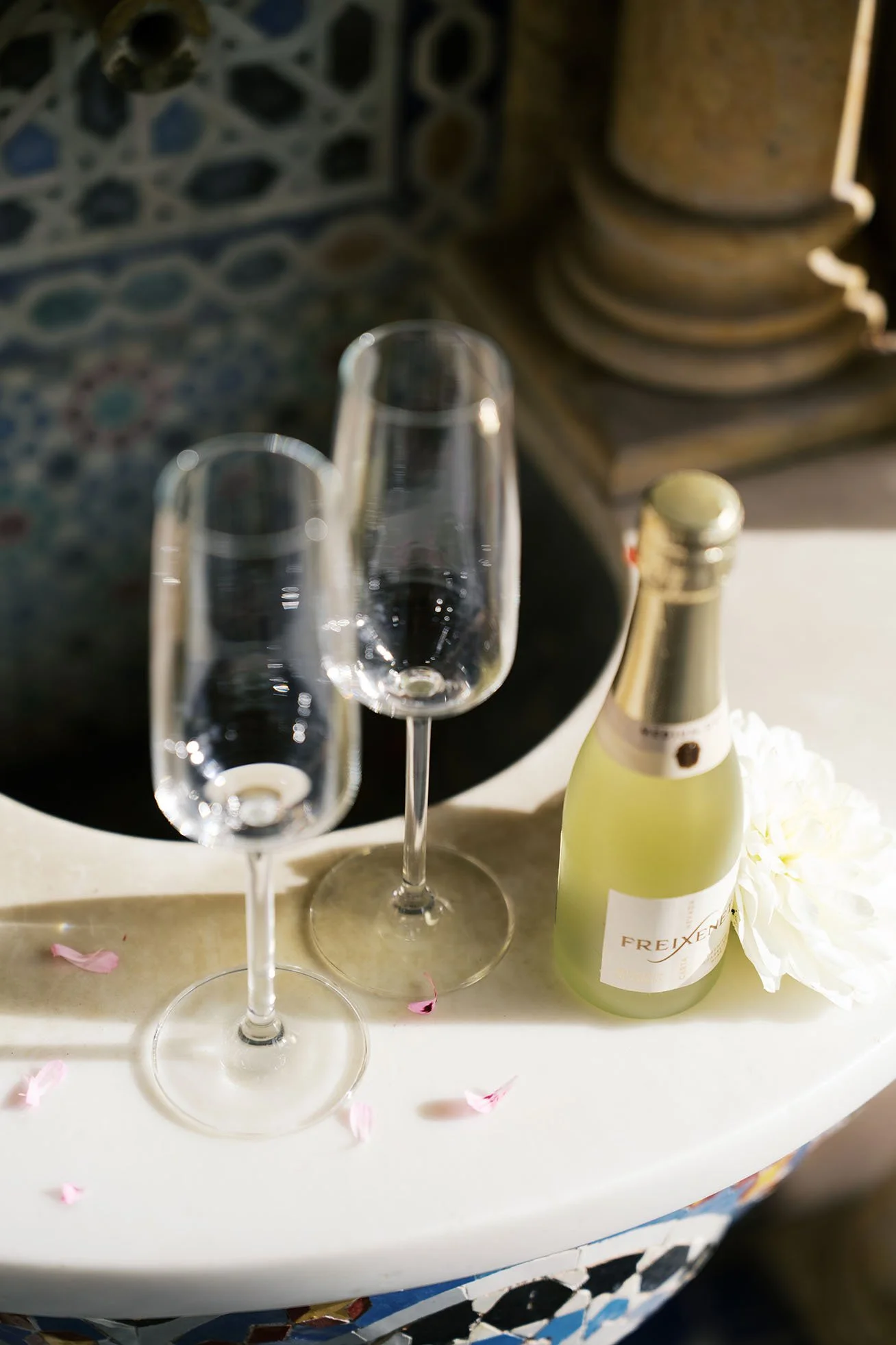 Champagne with glasses with floral decoration for a champagne toast.