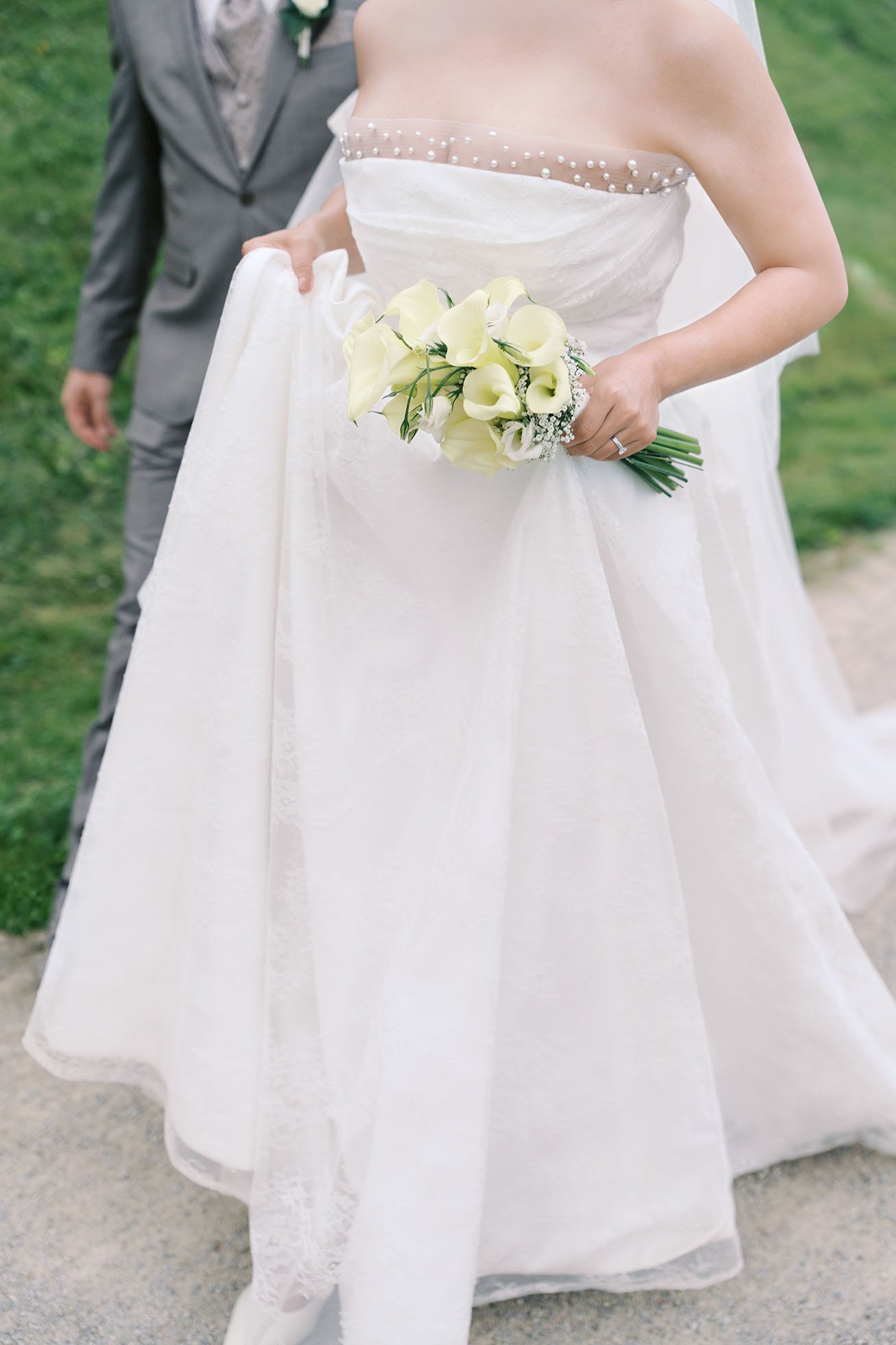 Wedding dress and bouquet of a bride before a wedding in Berlin.