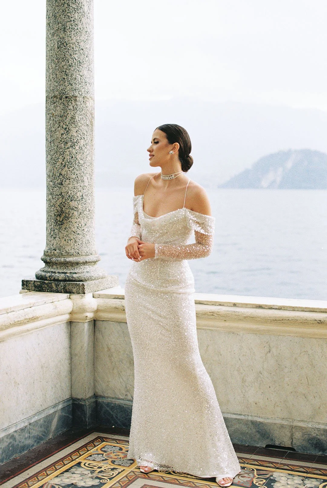 Modern, glamorous bride posing for her portrait at Villa Monastero Garden in Varenna.