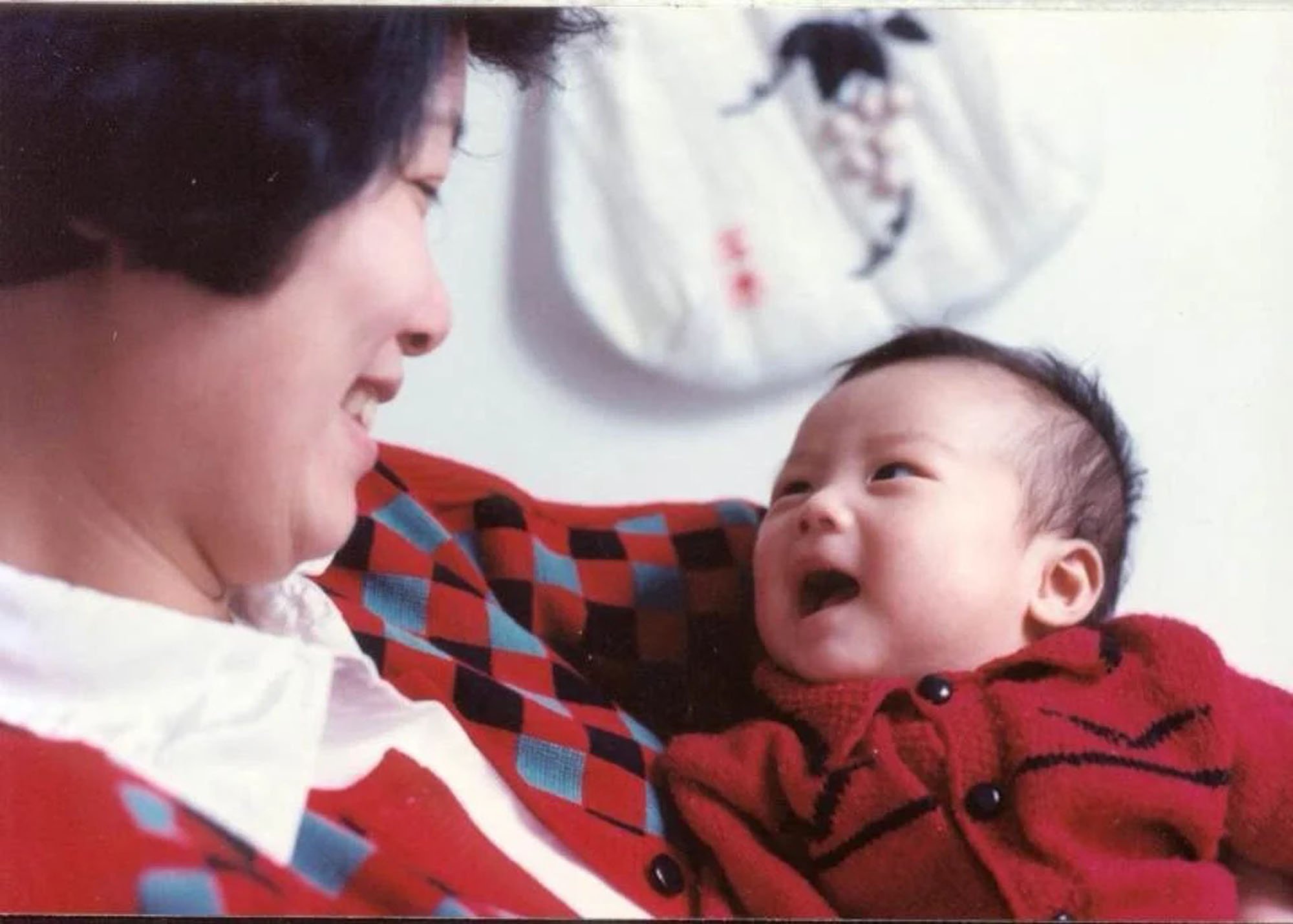 Germany wedding photographer as a baby, looking up at parent
