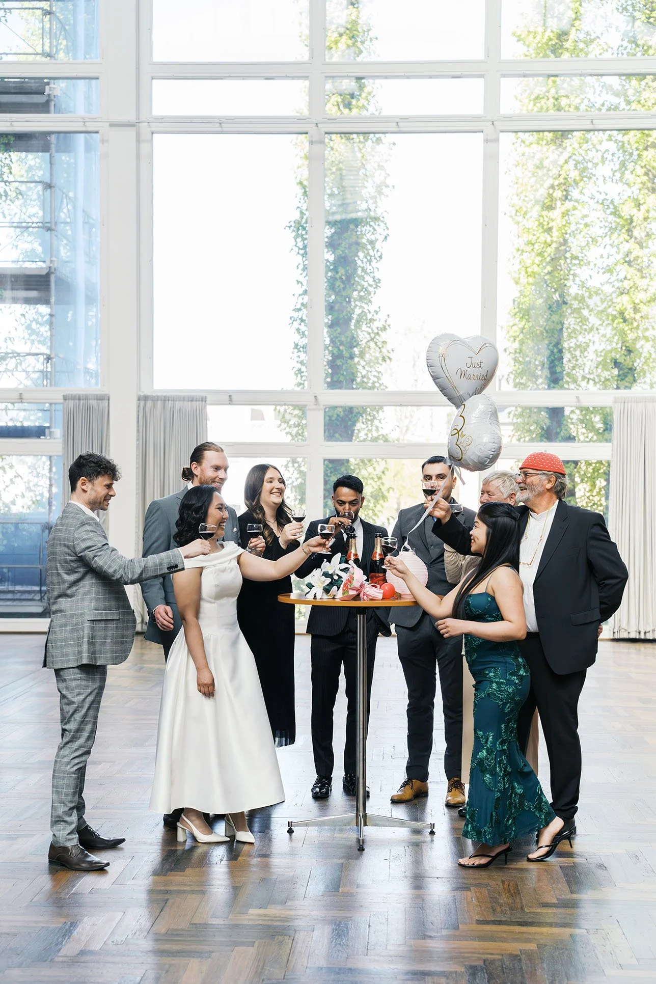 After-wedding celebration with friends and families around high tables at Aarhus City Hall.